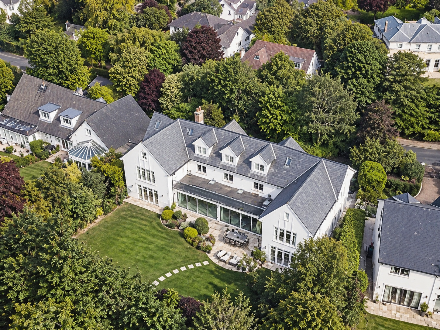 Meadowlands, Islay Road, Lytham, Lancashire — aerial view of the rear elevation of a luxury detached residence featuring traditional architecture, extensive glazing, landscaped terraces and mature private gardens.