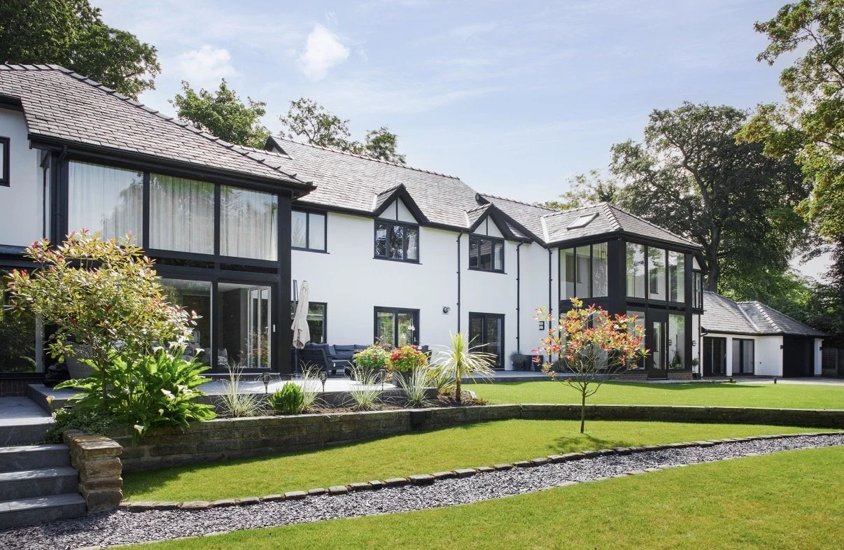 7 Church Drive, Lytham — rear elevation showing extensive residential remodelling, contemporary glazed extensions, traditional architectural detailing and landscaped gardens.