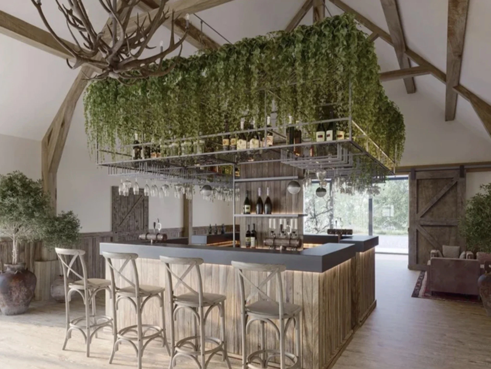 River Barns Wedding Venue, Lancashire — Reception Bar Interior Design — bespoke bar within a converted rural barn, featuring exposed timber roof trusses, natural wood finishes and a suspended botanical installation incorporating glassware and display