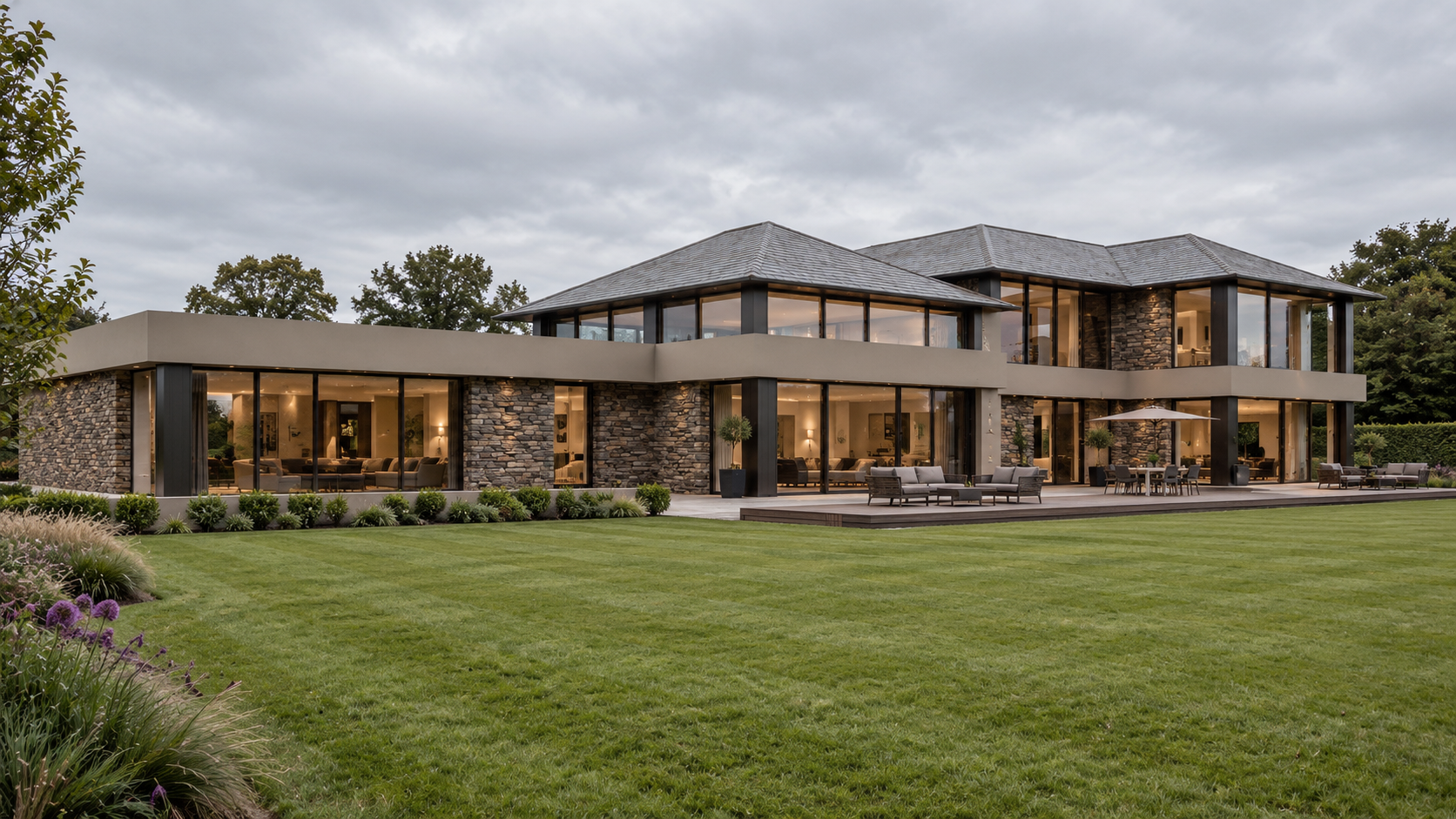 South-facing garden elevation of Bankfield, Poolfoot Lane, Singleton, Lancashire, a bespoke new-build country house designed by  Joel Firth. 