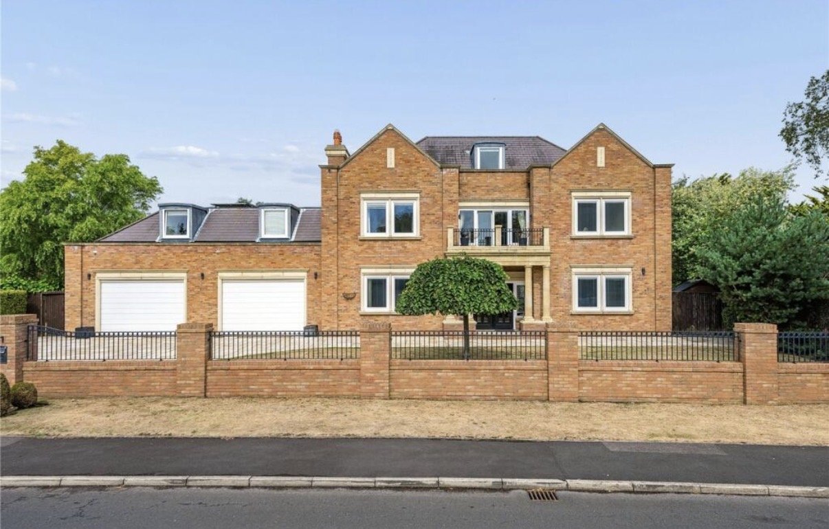 Regent Avenue, Lytham St Annes, Lancashire — substantial new-build family residence featuring traditional red brick architecture, symmetrical gabled elevations, a central entrance balcony and integrated double garage. 