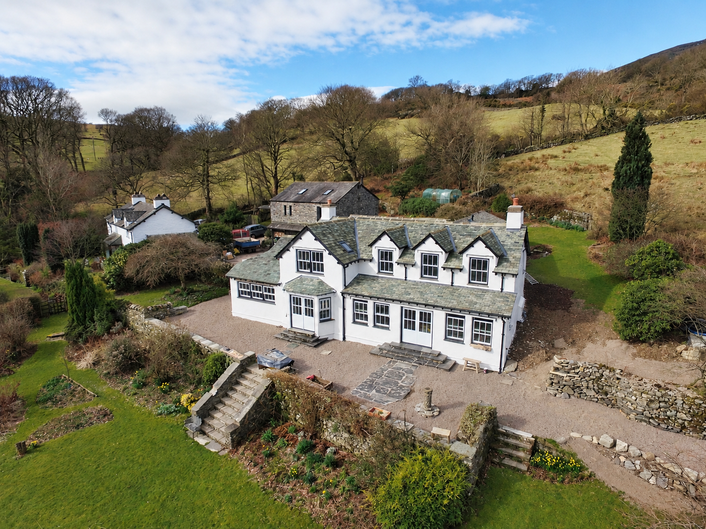 Completed Coniston farmhouse redevelopment, combining traditional Lakeland architecture with contemporary family living\. Turning a 1970’s farmhouse into an authentic Lakeland home.