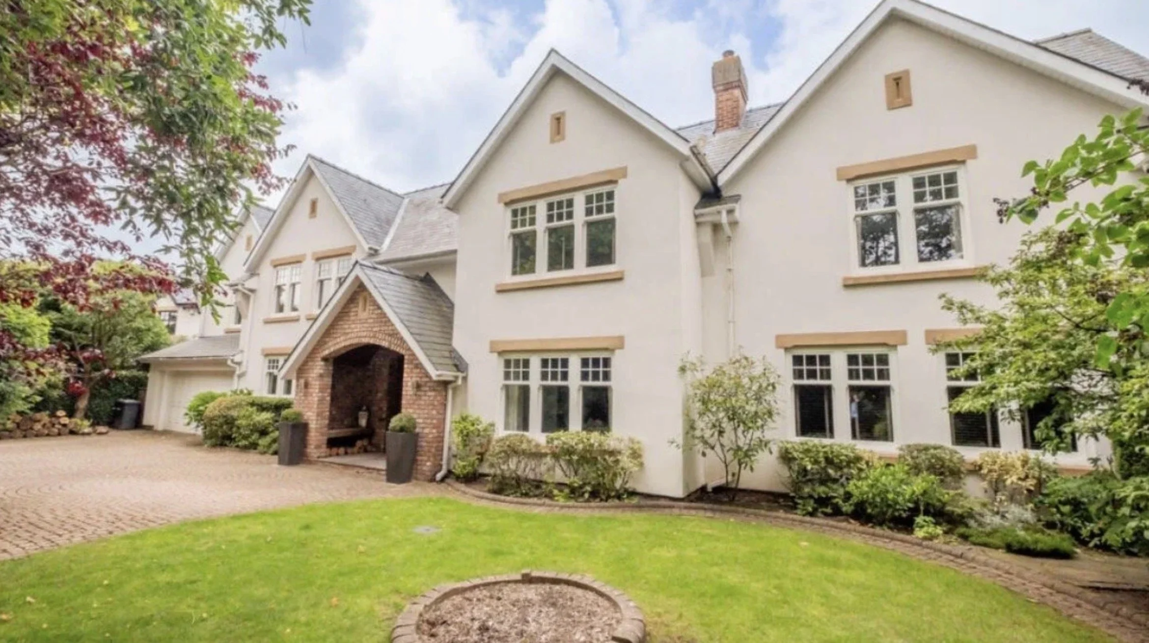 Meadowlands, Islay Road, Lytham, Lancashire — elegant front elevation of a luxury detached residence featuring traditional gabled architecture, a stone entrance porch, landscaped gardens and a sweeping private driveway.