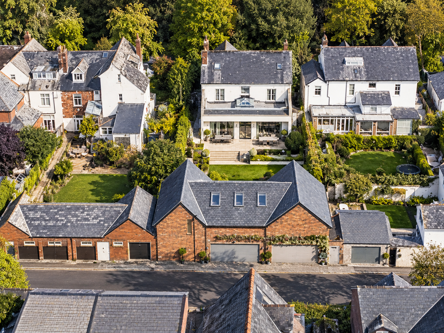 Rear Aerial View — Extensive renovation and extensions connecting the main residence with landscaped gardens and ancillary accommodation.