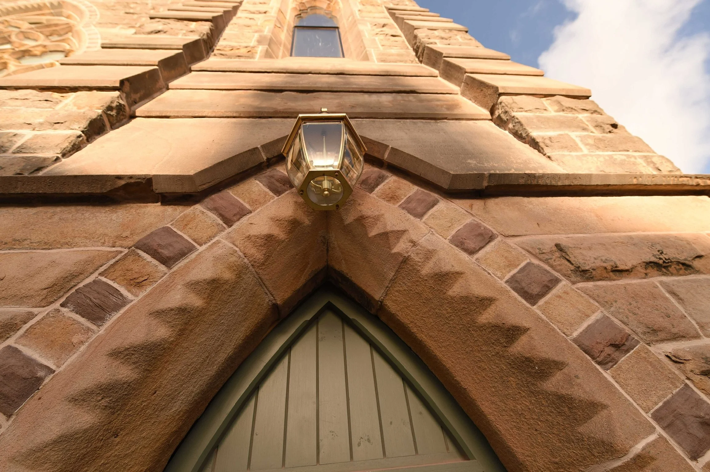     Original carved stone entrance detailing preserved during the listed building conversion in Lytham.