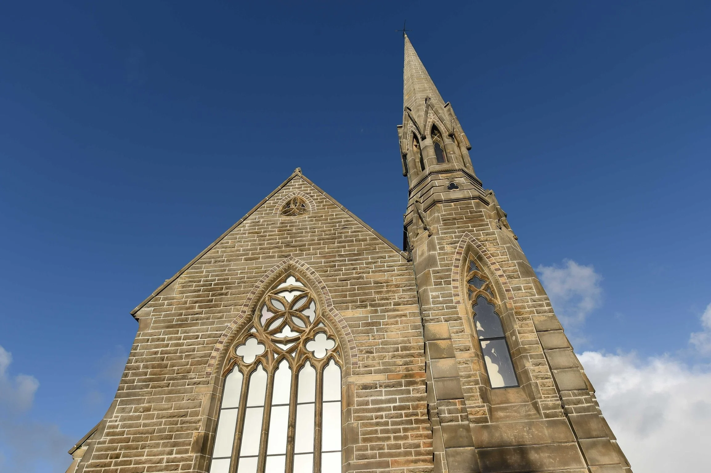     Historic church elevation and Gothic window retained within the Lytham listed building conversion.