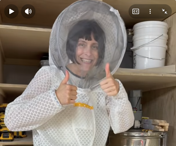 Sister Bee giving a thumbs up while wearing her Jeometry Beewear Sunny Suit made for women beekeepers