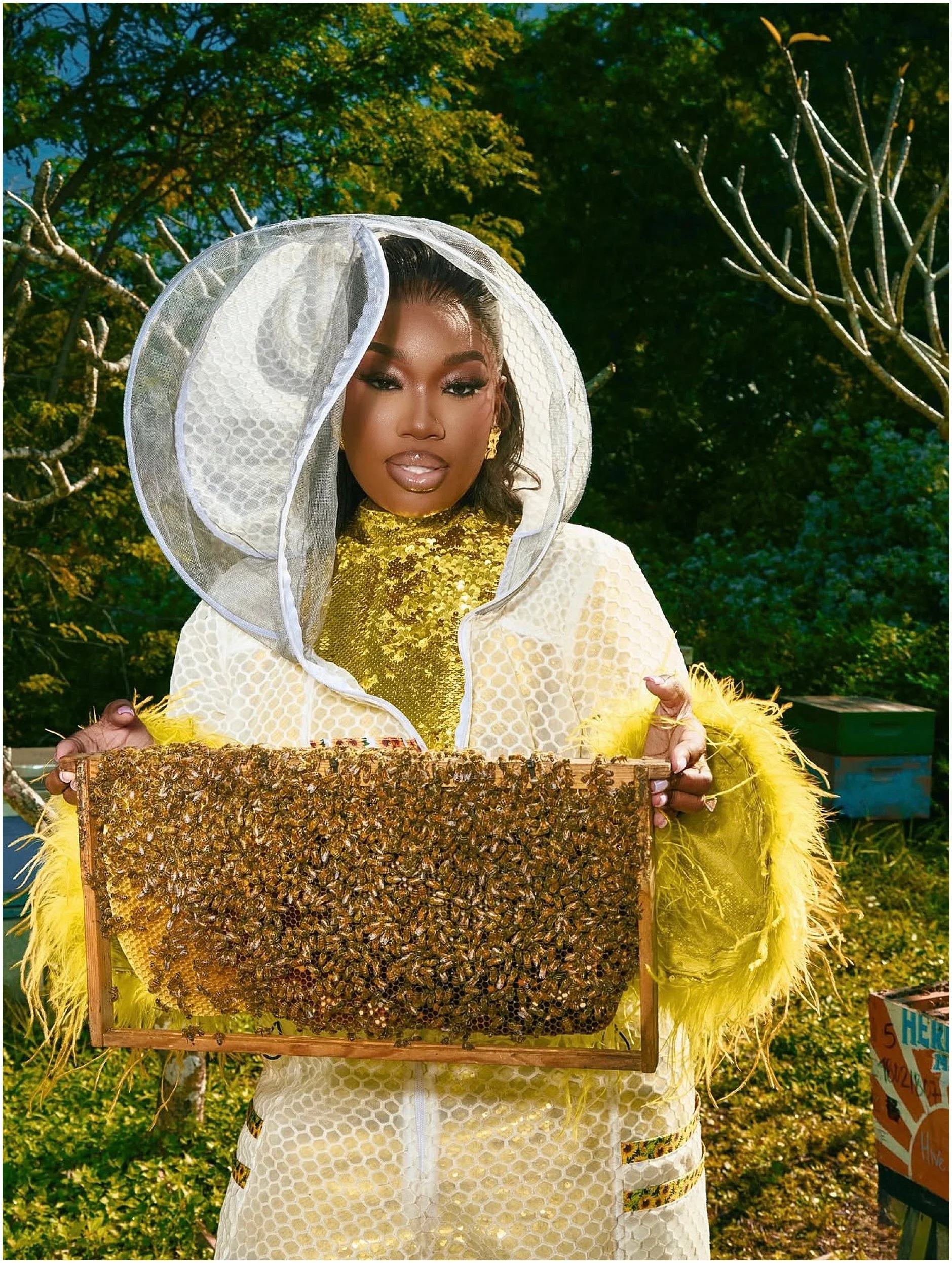 Bride-to-be Erika wearing the Jeometry Sunny Suit women’s beekeeping suit during her engagement photo session in the apiary.