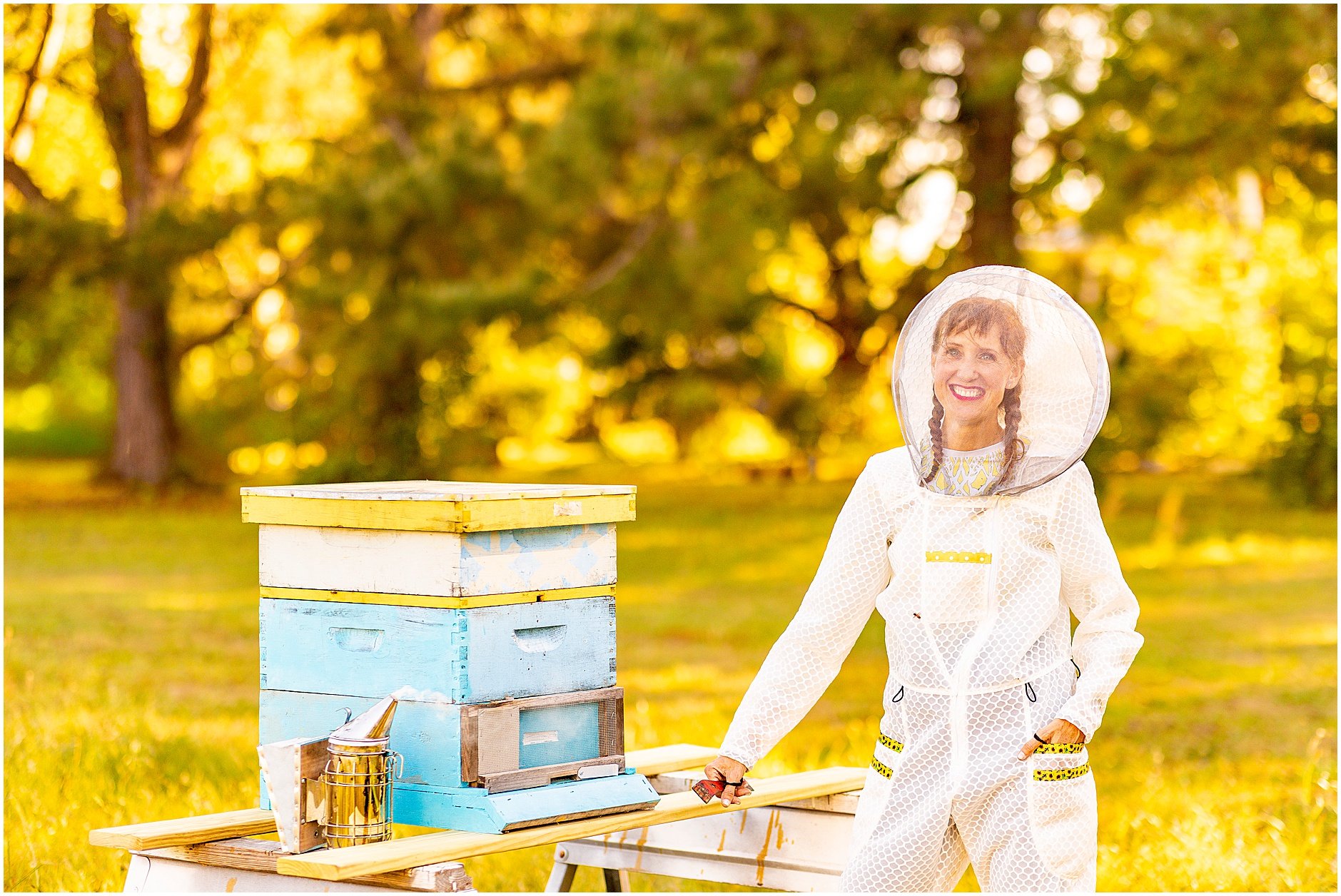 Jennifer York, Jeometry Beewear™ founder and designer, showing off the Sunny Suit in her Folly Beach apiary