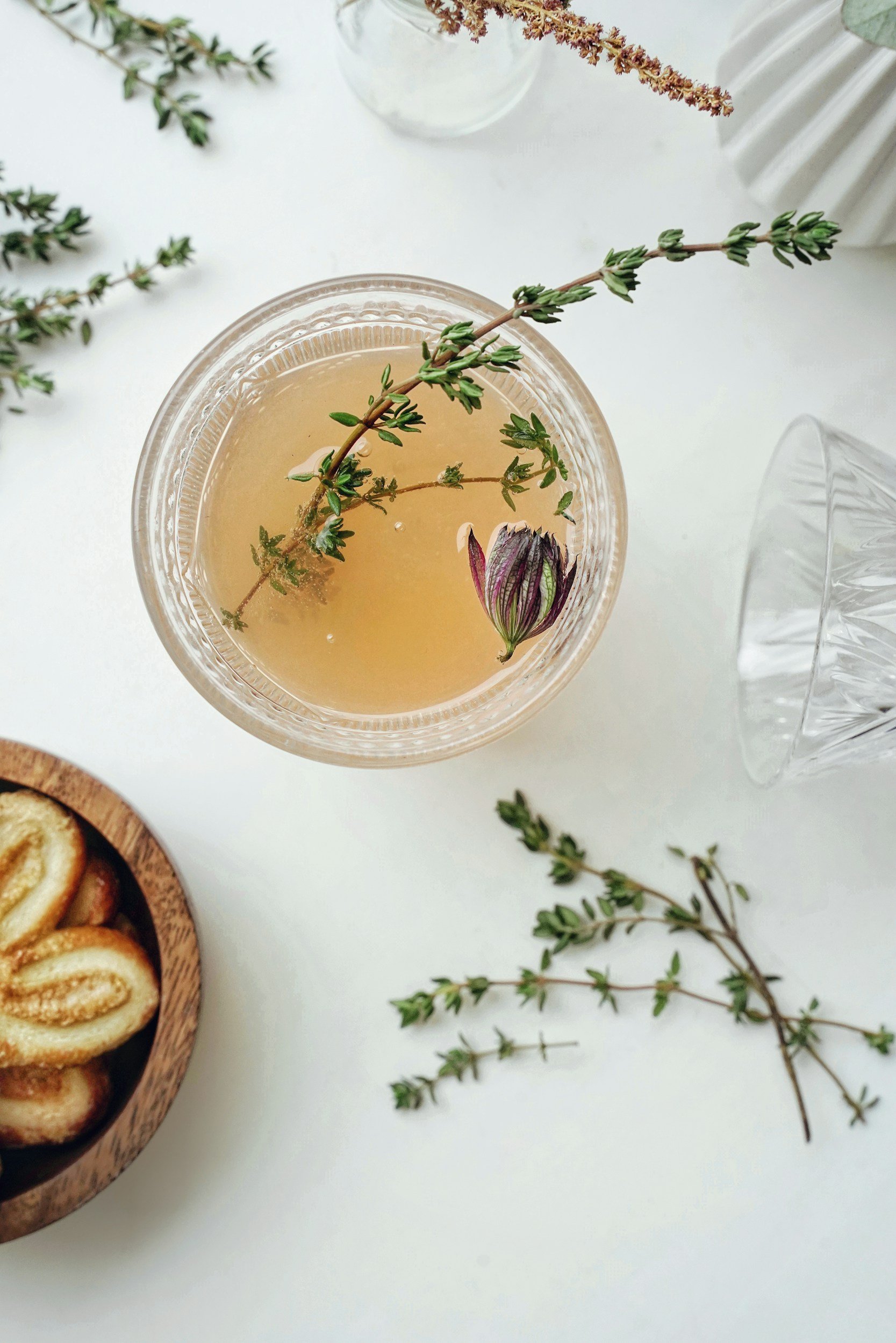 Thyme tea with fresh Thyme sprig garnishing the glass