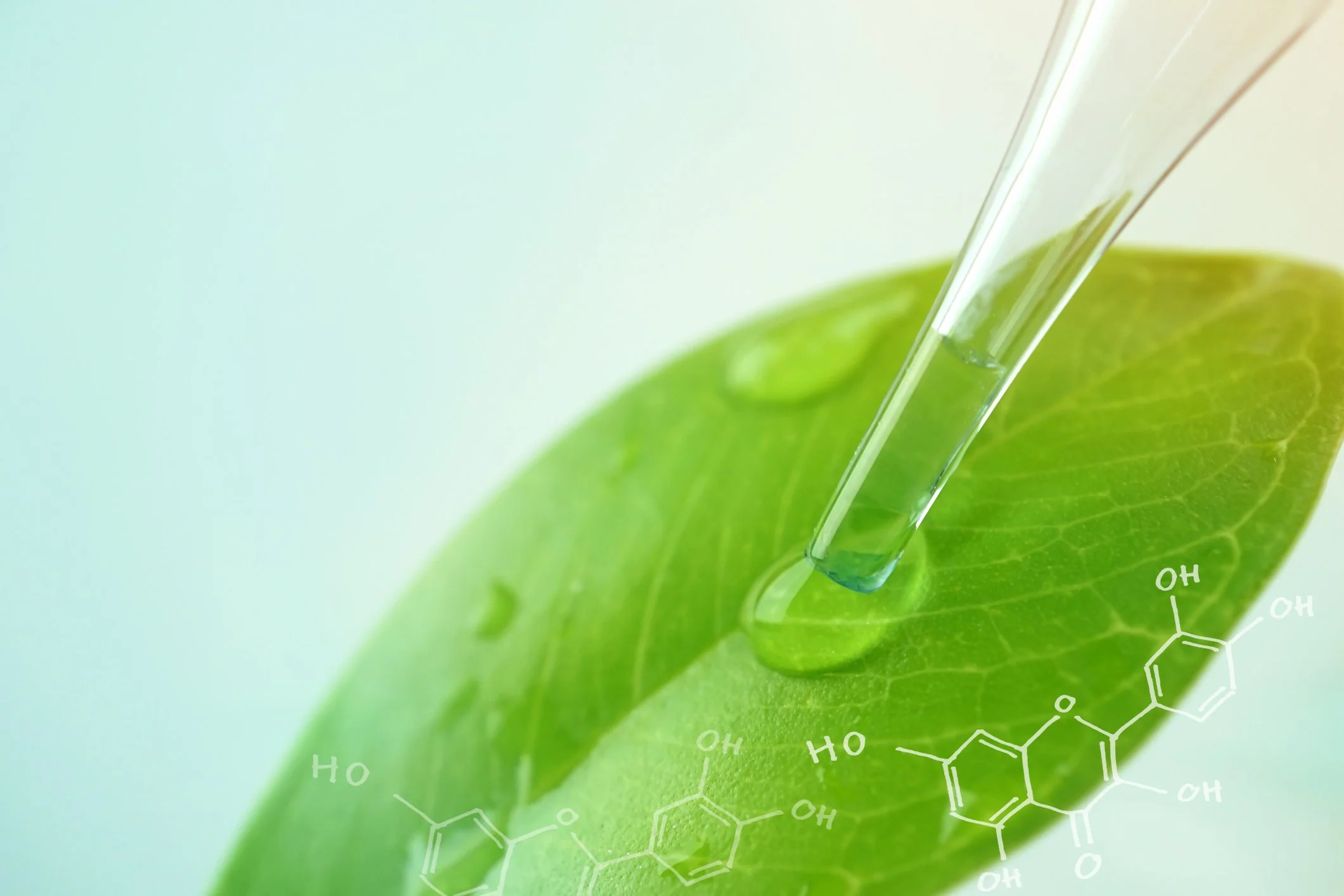 Close-up of a green leaf with a pipette releasing a clear liquid, with chemical structures overlaid.