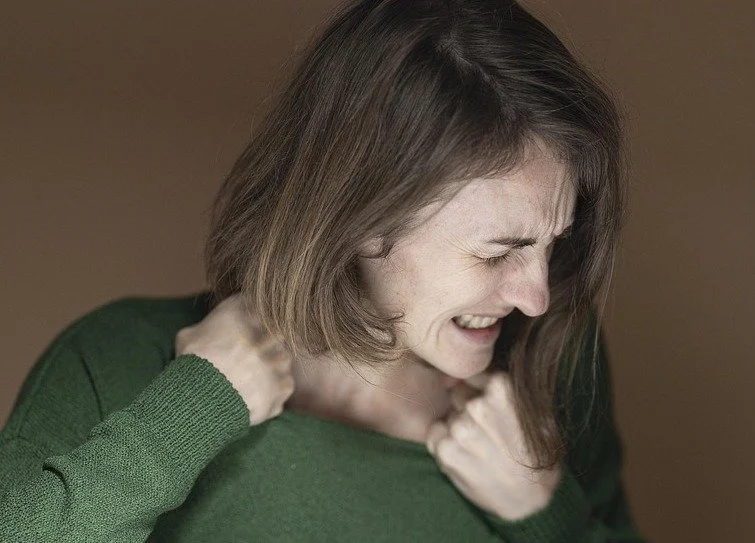 this image shows a woman feeling frustrated