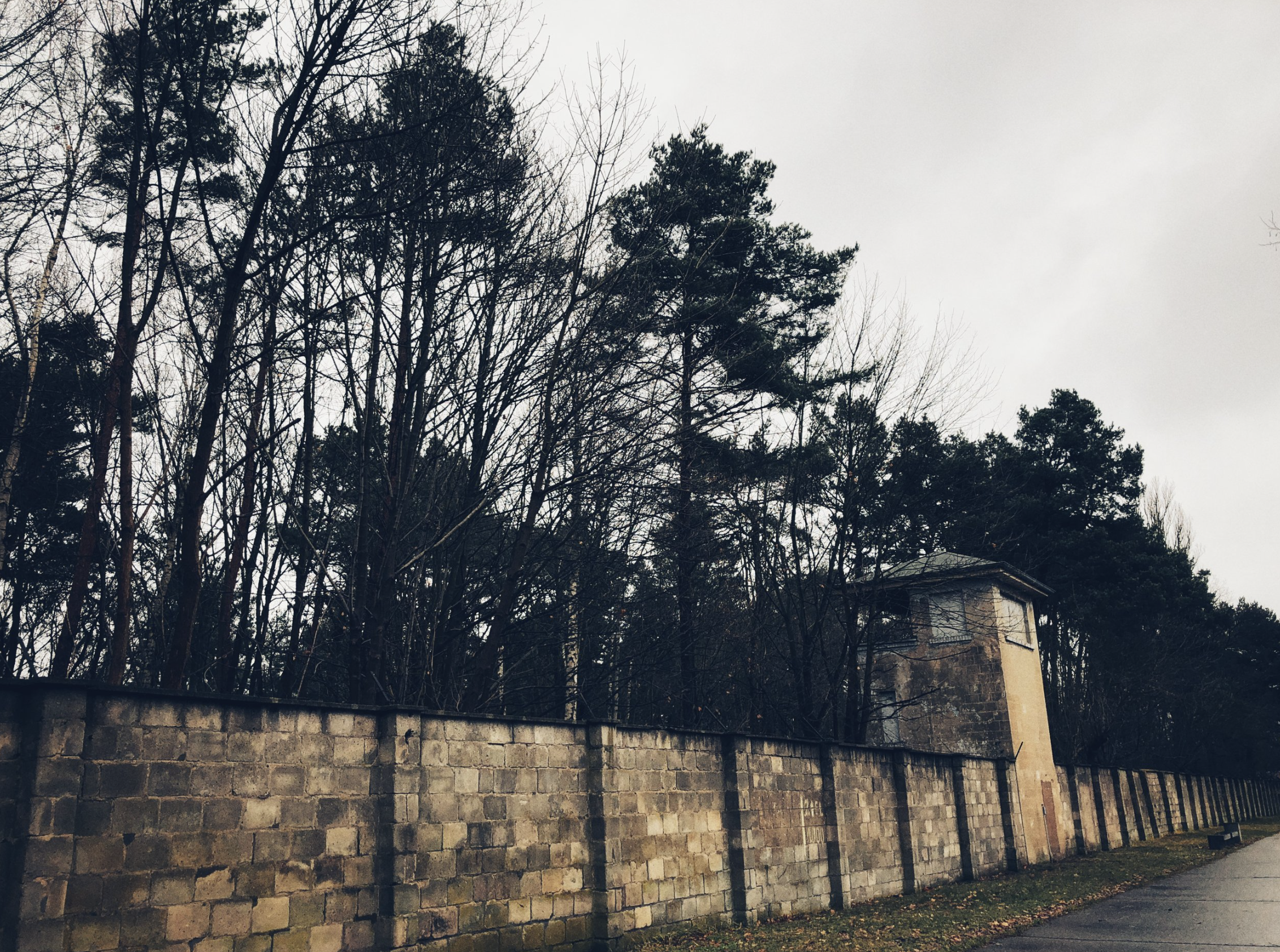 The perimeter wall and guard tower of Sachsenhausen concentration camp in Oranienburg, Germany, photographed by WWII historian Erin Faith Allen in winter 2017