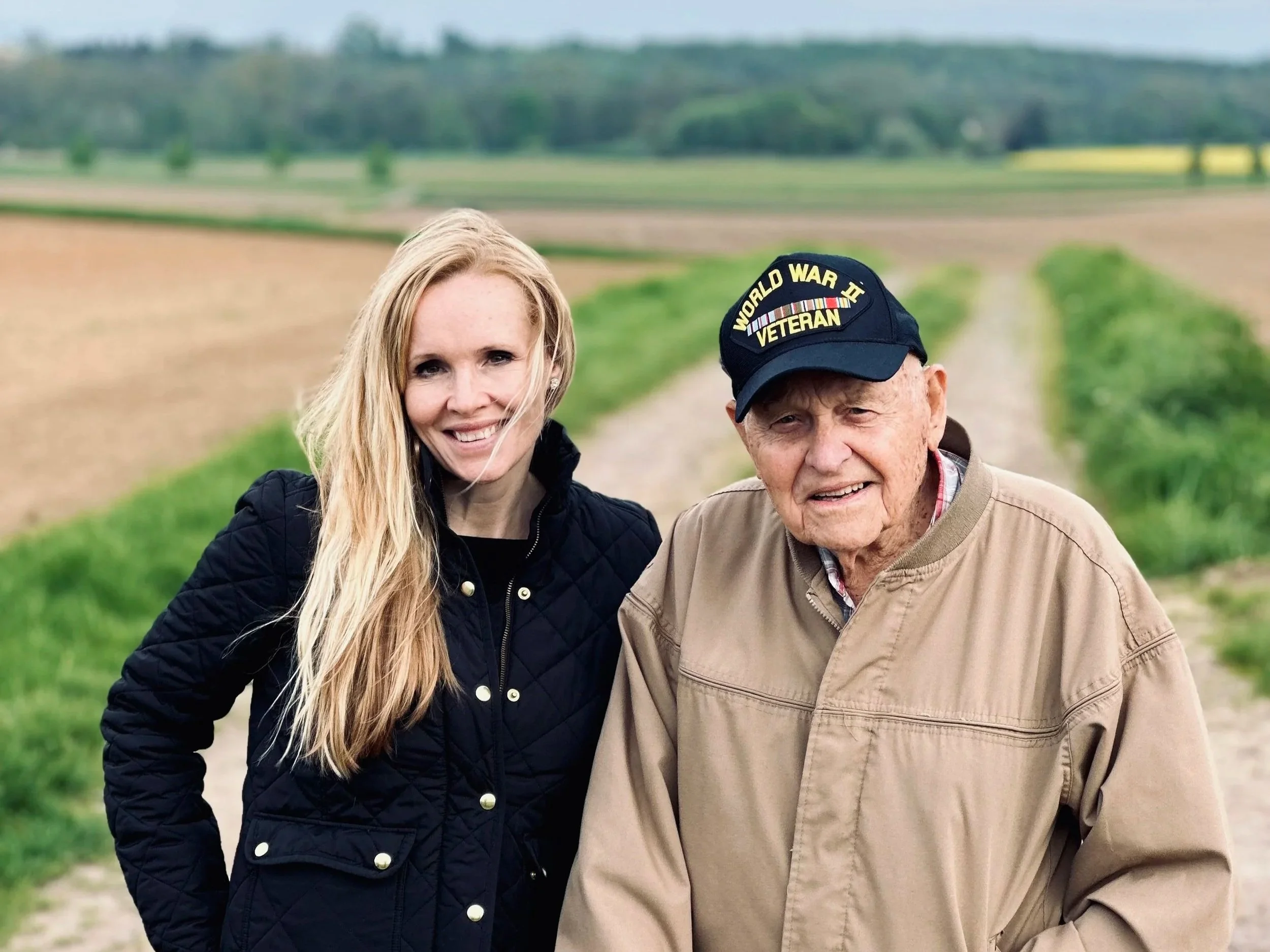Historian Erin Faith Allen and 42nd Rainbow Division veteran Lockered Bud Gahs at the site of his first gun position, Alsace, France, spring 2023