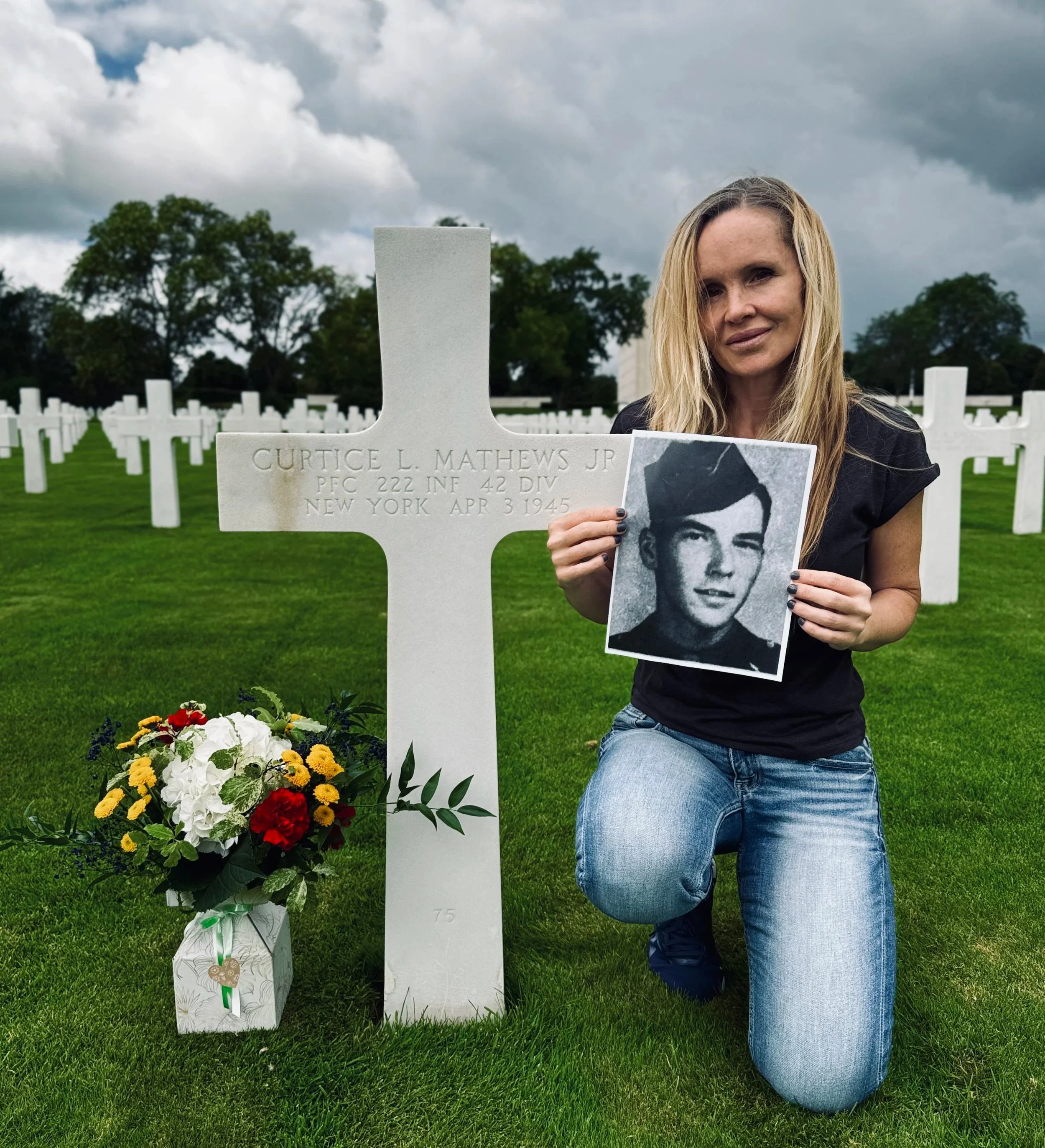 Investigative war historian Erin Faith Allen visits the grave of Curtice L. Mathews, who served in the 222nd Infantry Regiment of the 42nd Rainbow Division and was killed in Wurzburg, Germany, in April 1945.