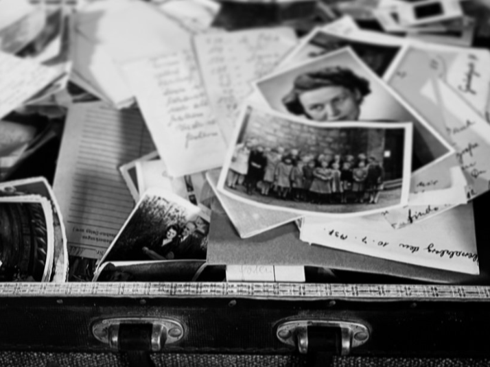 Erin Faith Allen, historian, investigates the stories that live in a pile of photographs, handwritten notes, and papers scattered inside an open vintage suitcase