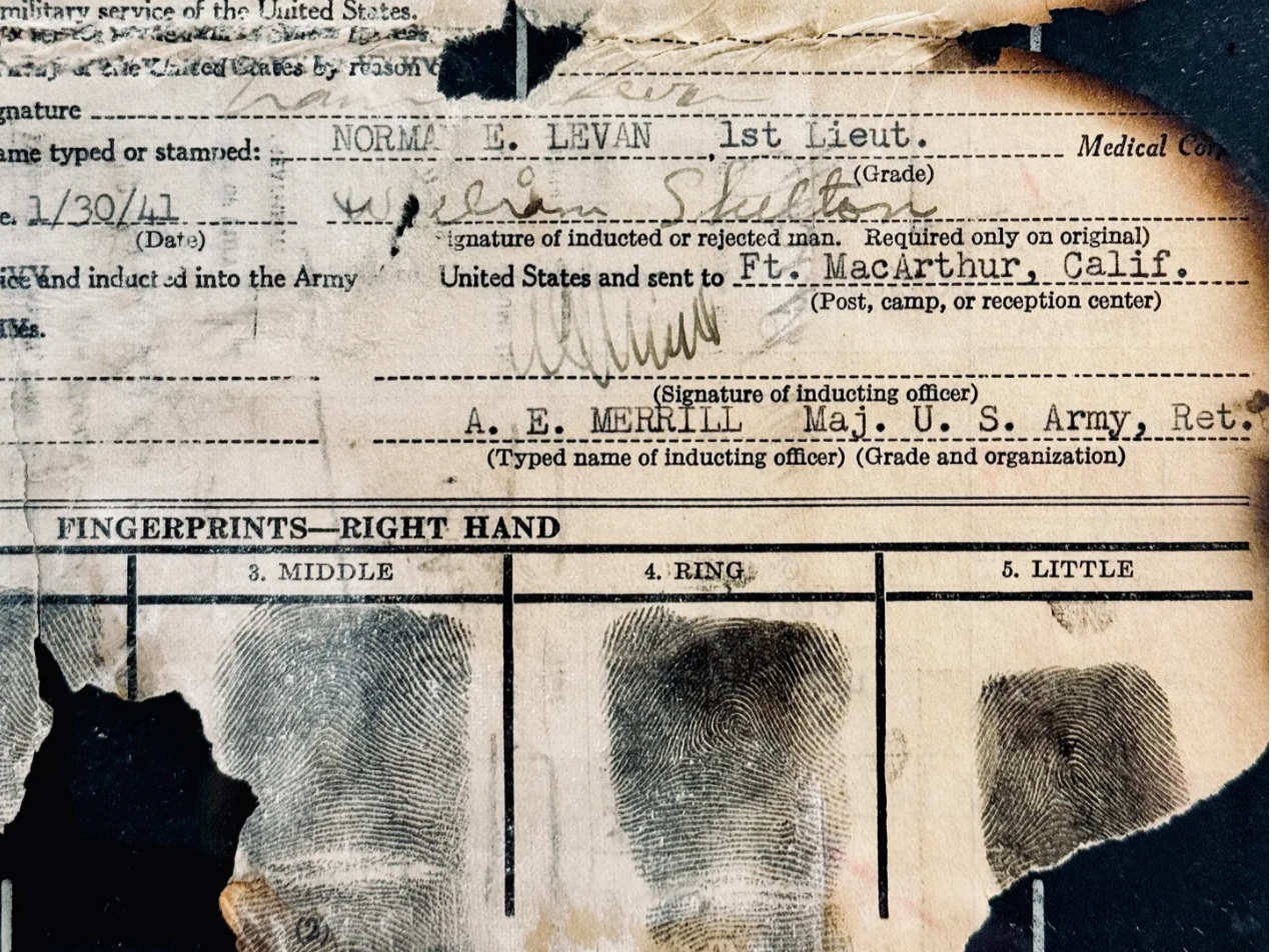 Historian Erin Faith Allen shares a burned military personnel file, or OMPF, from the National Personnel and Records Administration, or NPRC, in St Louis
