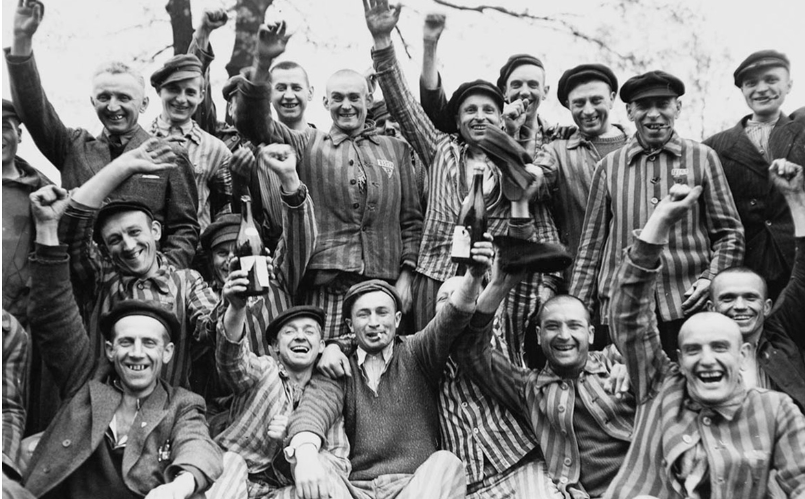 42nd Rainbow Infantry Division soldiers liberate prisoners at Dachau concentration camp, April 29 1945