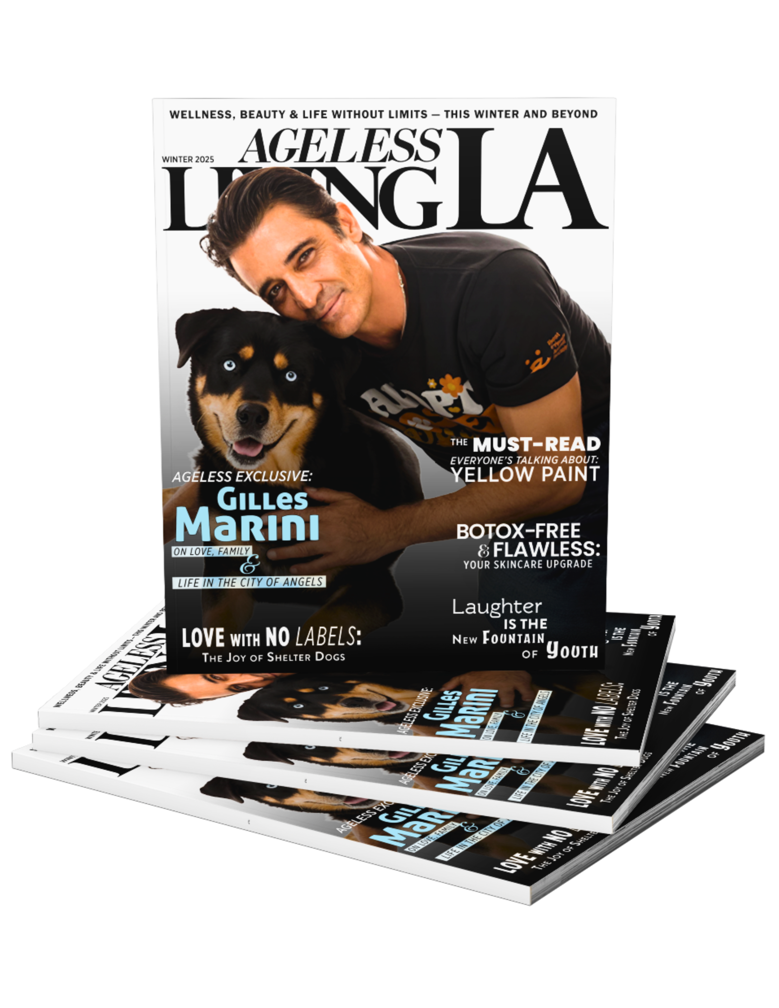 Stack of magazines with a cover featuring a man with dark hair and a black t-shirt, smiling and hugging a black and tan dog with blue eyes.