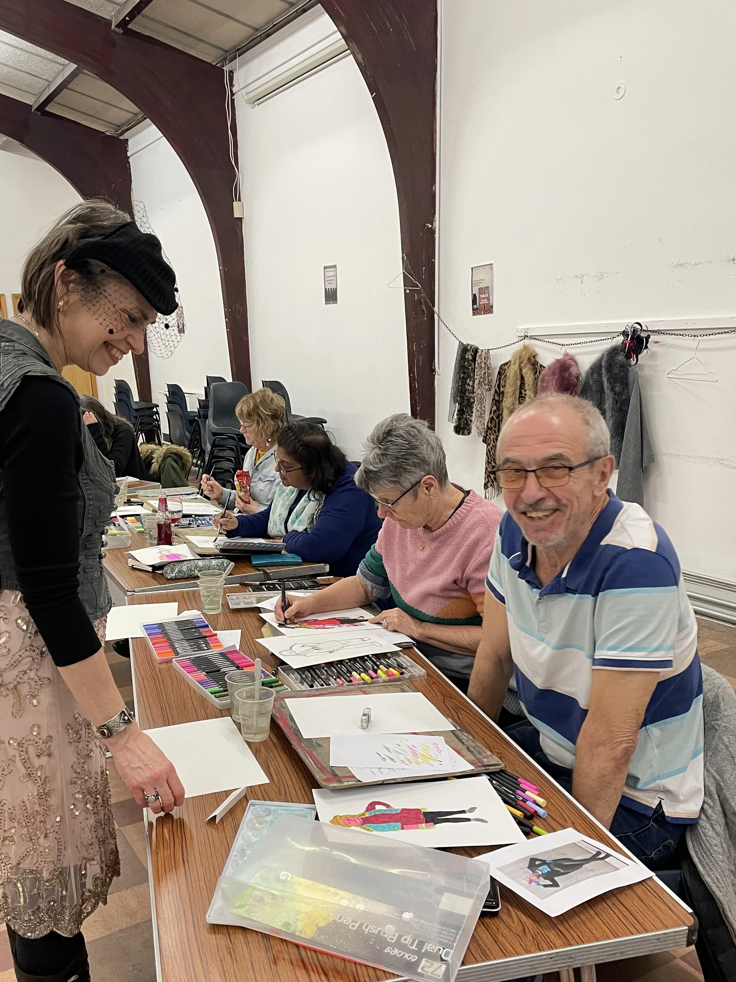 Zoe Parker giving fashion illustration instruction to a participant.JPG