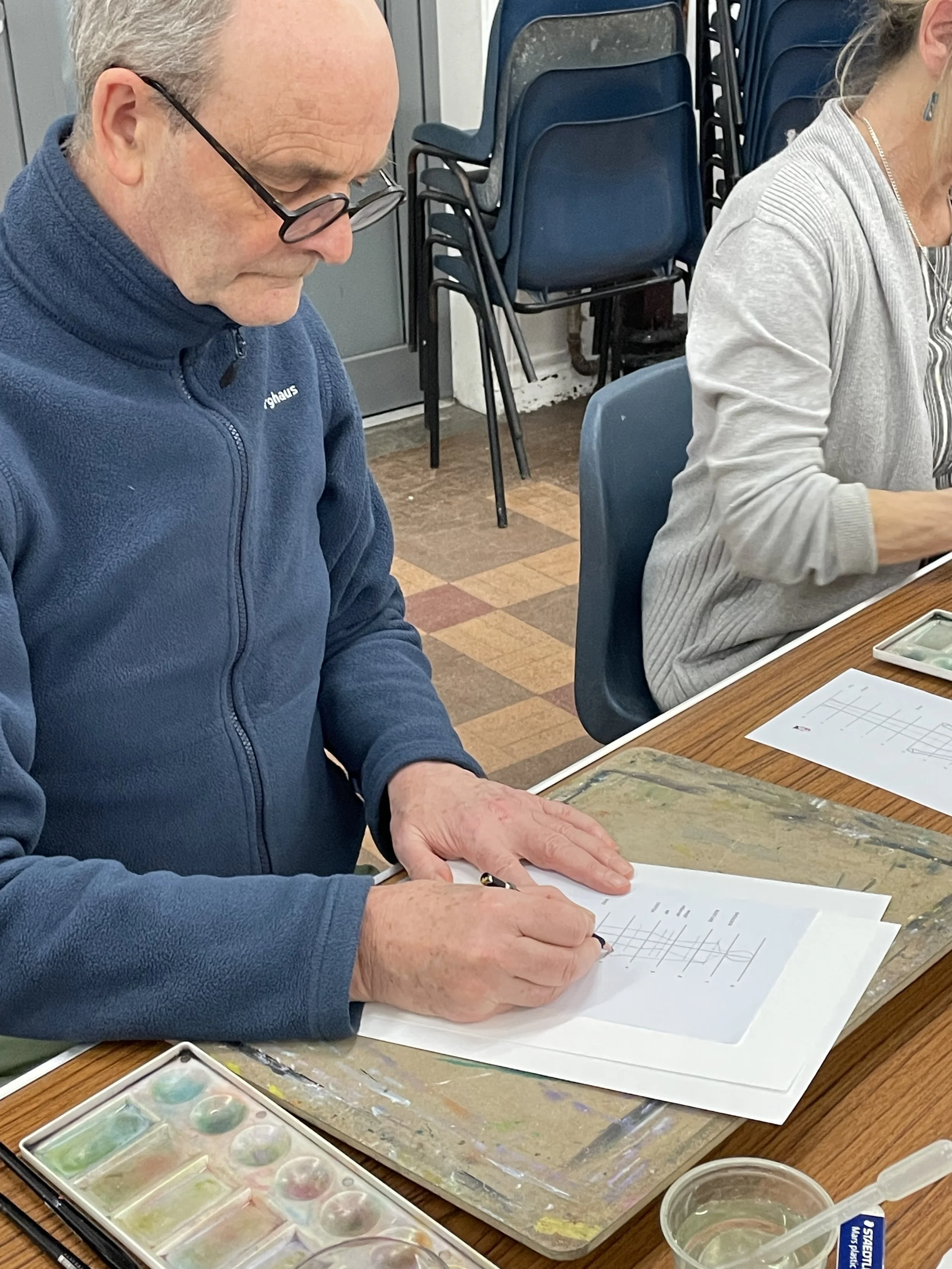 Drawing concentration at fashion illustration workshop.JPG