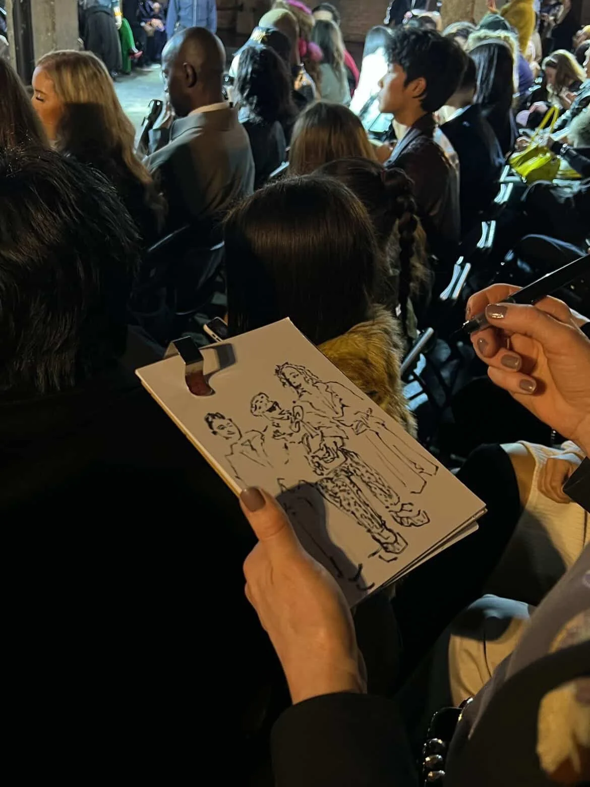 Justin Cassin photo of me drawing at the show by Tigma Barfiwala.JPG
