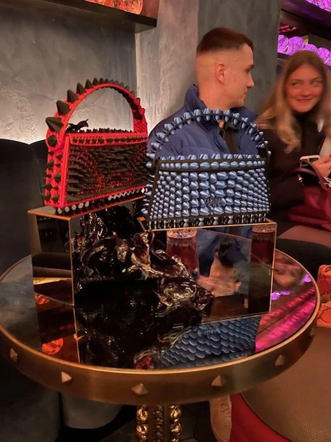 handbags on the bar table Karina Bond Vivarium.jpg