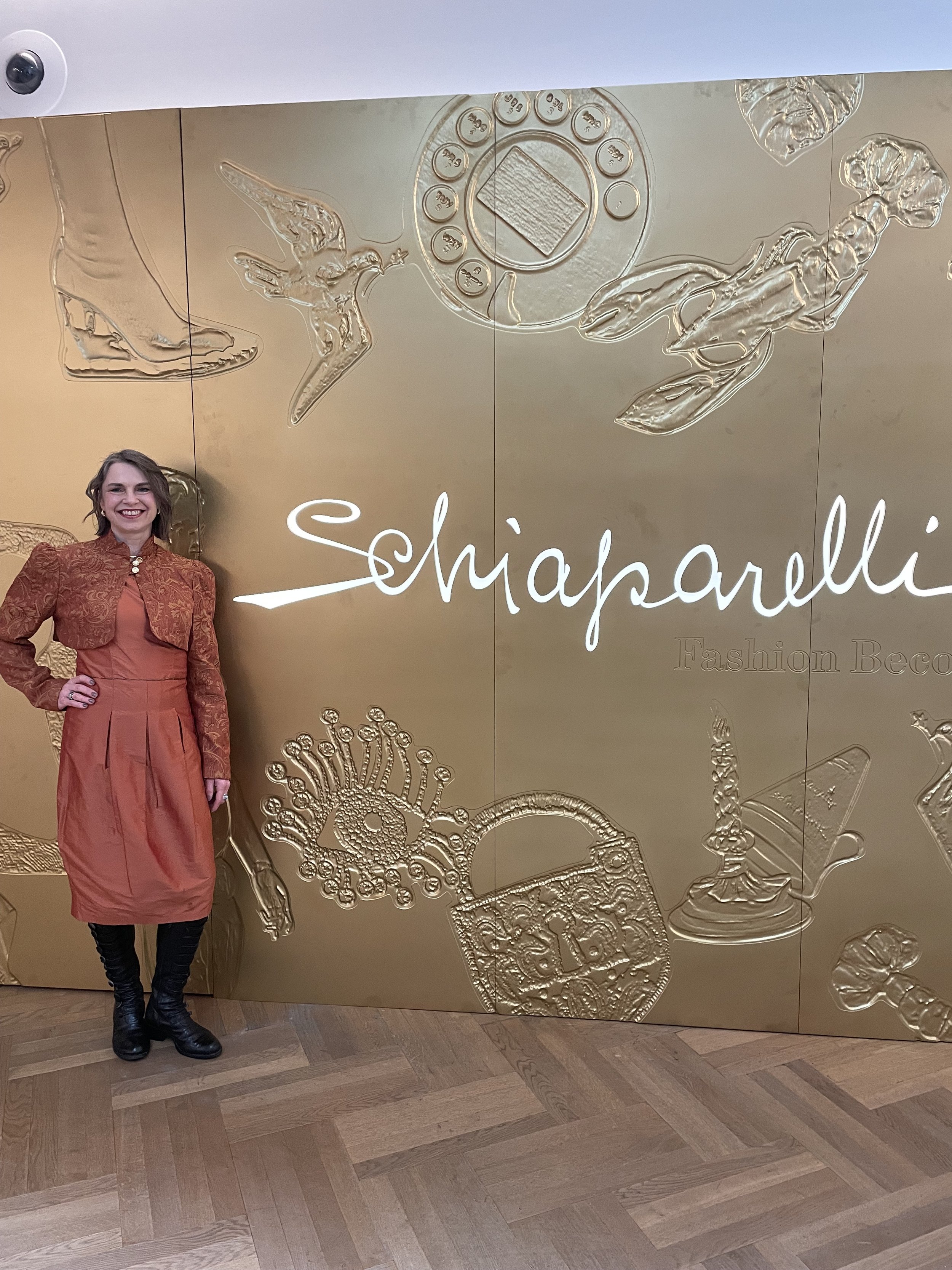Schiaparelli photo of Zoe Parker Illustration full length pic in front of entrance to exhibition.JPEG