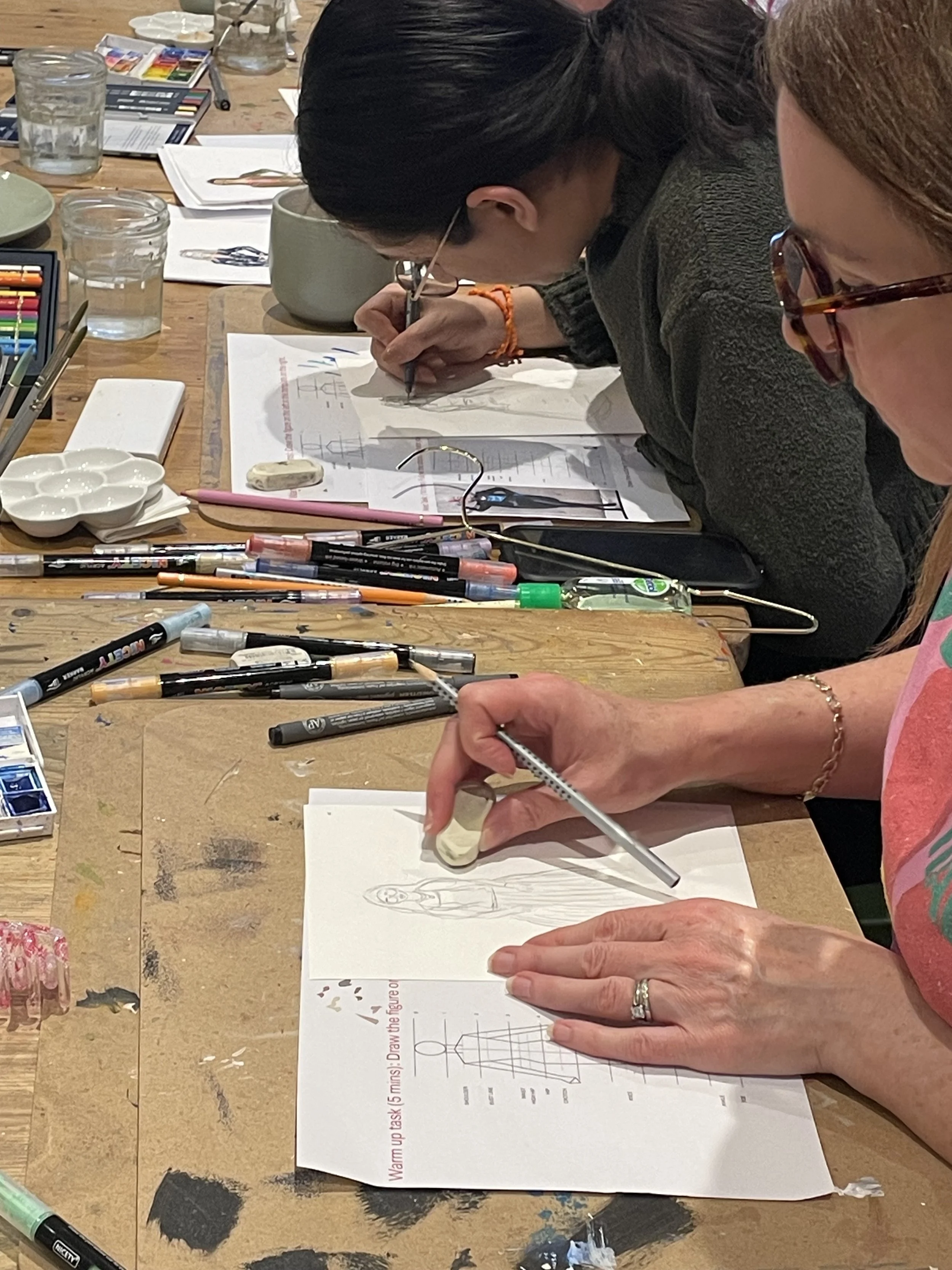 Participants focus on creating fashion illustration at Dress Up and Draw Hive Zoe Parker Illustration.JPEG