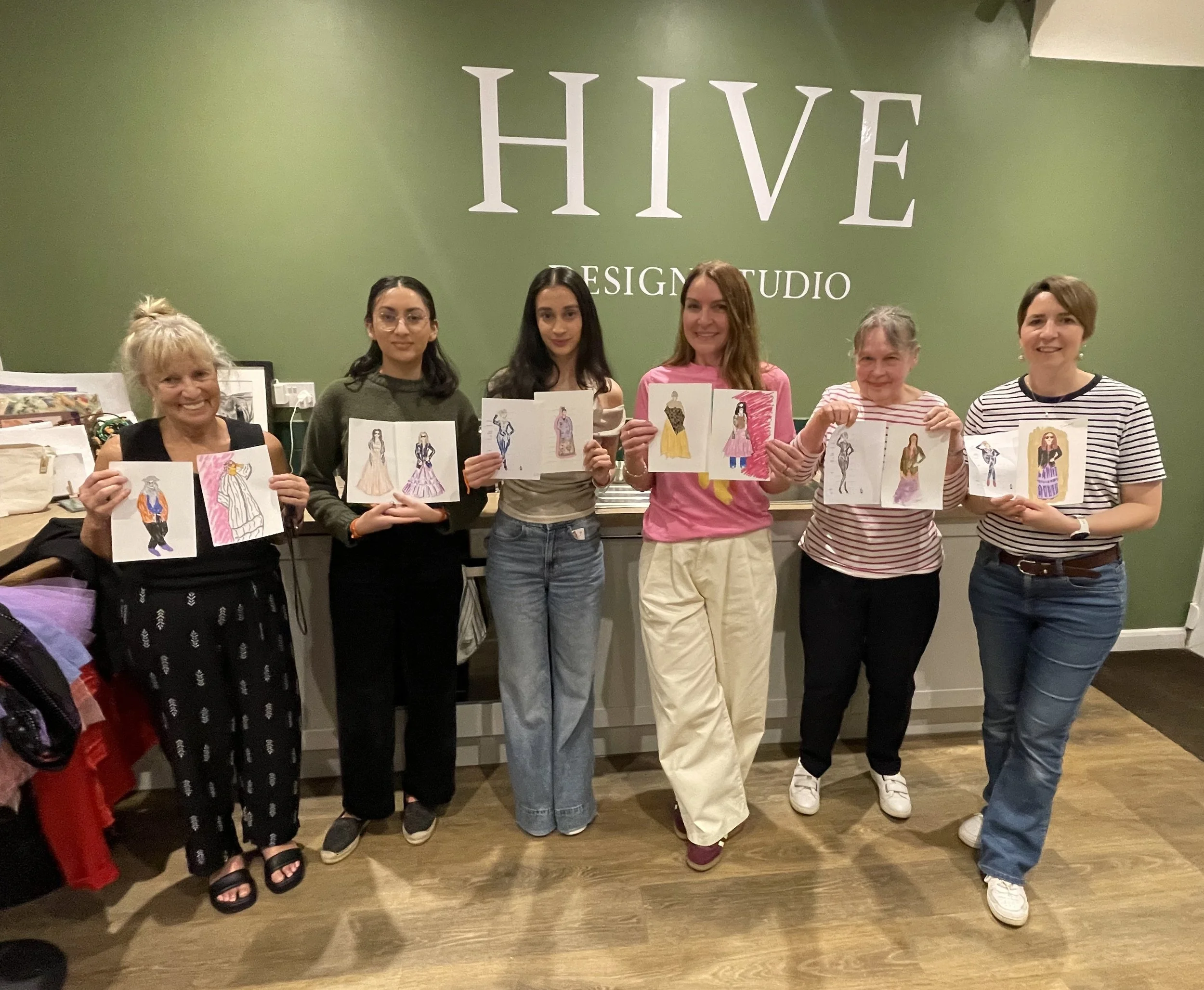 Smiling Group with their finished drawings at Dress Up and Draw Hive Zoe Parker Illustration.JPEG