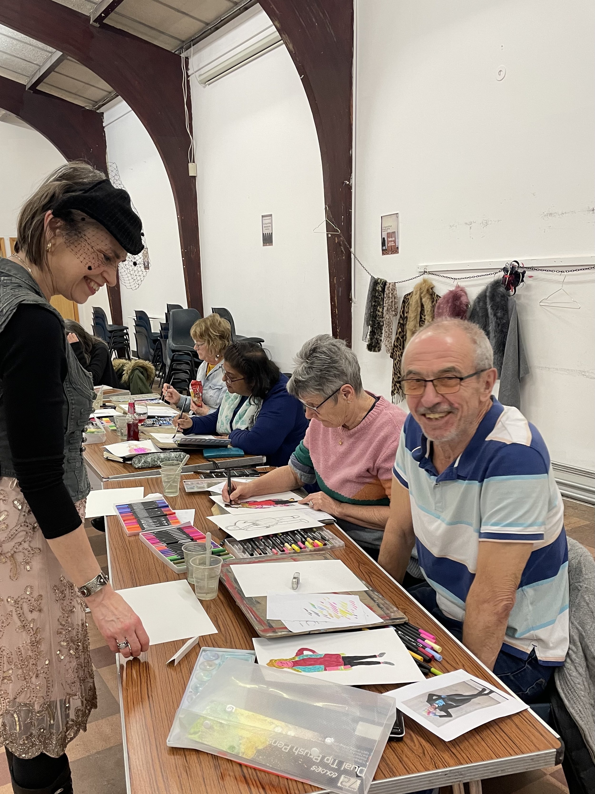 Zoe Parker giving fashion illustration instruction to a participant.JPG