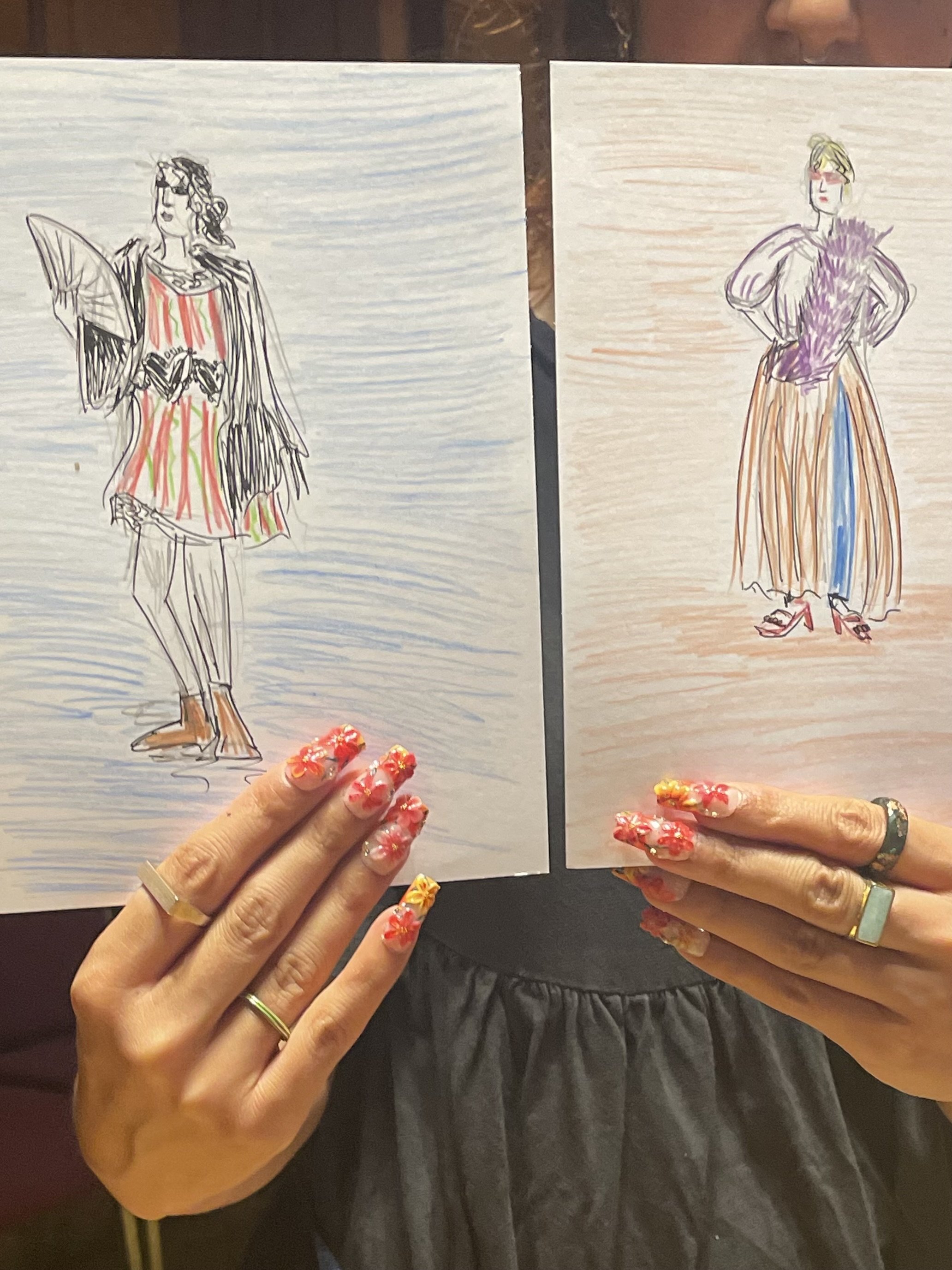 Dress Up and Draw at the Museum of Croydon, participant with fabulous nails shows their work..JPG