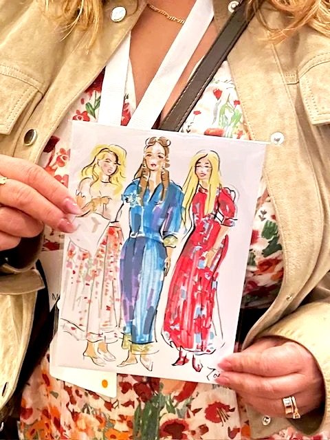 Live Illustration of three delegates at British Academy of Management conference. Three women in dresses drawn by Zoe Parker Illustration