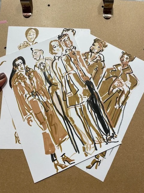 Caramel Rock drawings of models on clipboard.jpg