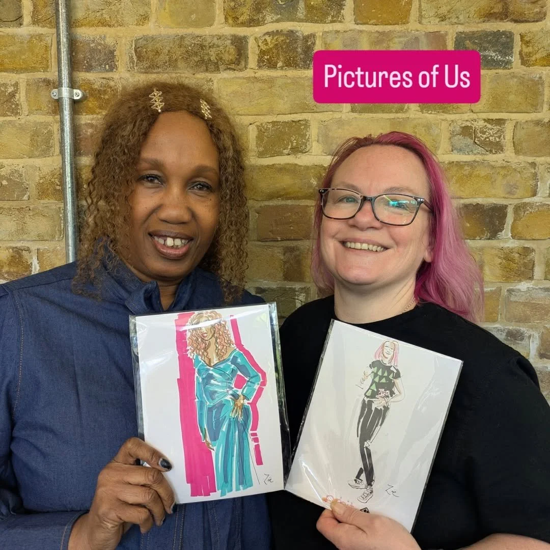 photograph of two people smiling and holding fashion illustration portrait drawings of themselves by Zoe Parker Illustration.jpg