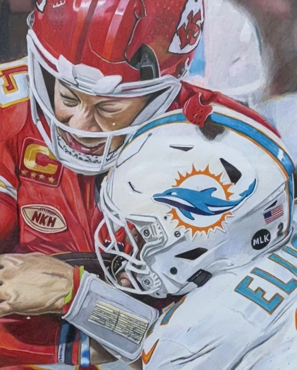 Mahomes being tackled by Miami defender and cracking helmet displayed at The Fusion at Parkville Frame Gallery. 