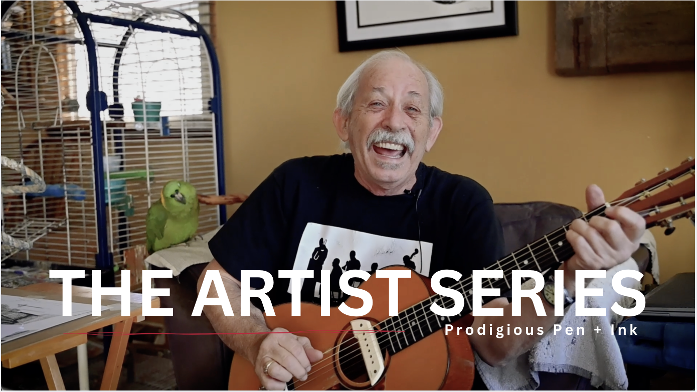 Rich Berry, smiling and playing an acoustic guitar in a cozy indoor space with a birdcage and a green parrot in the background.