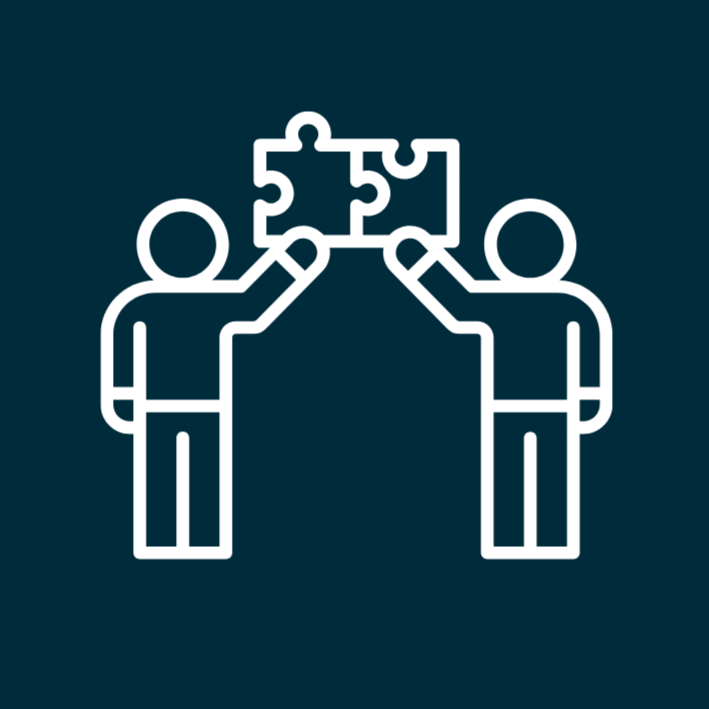 A graphic showing two people joining puzzle pieces