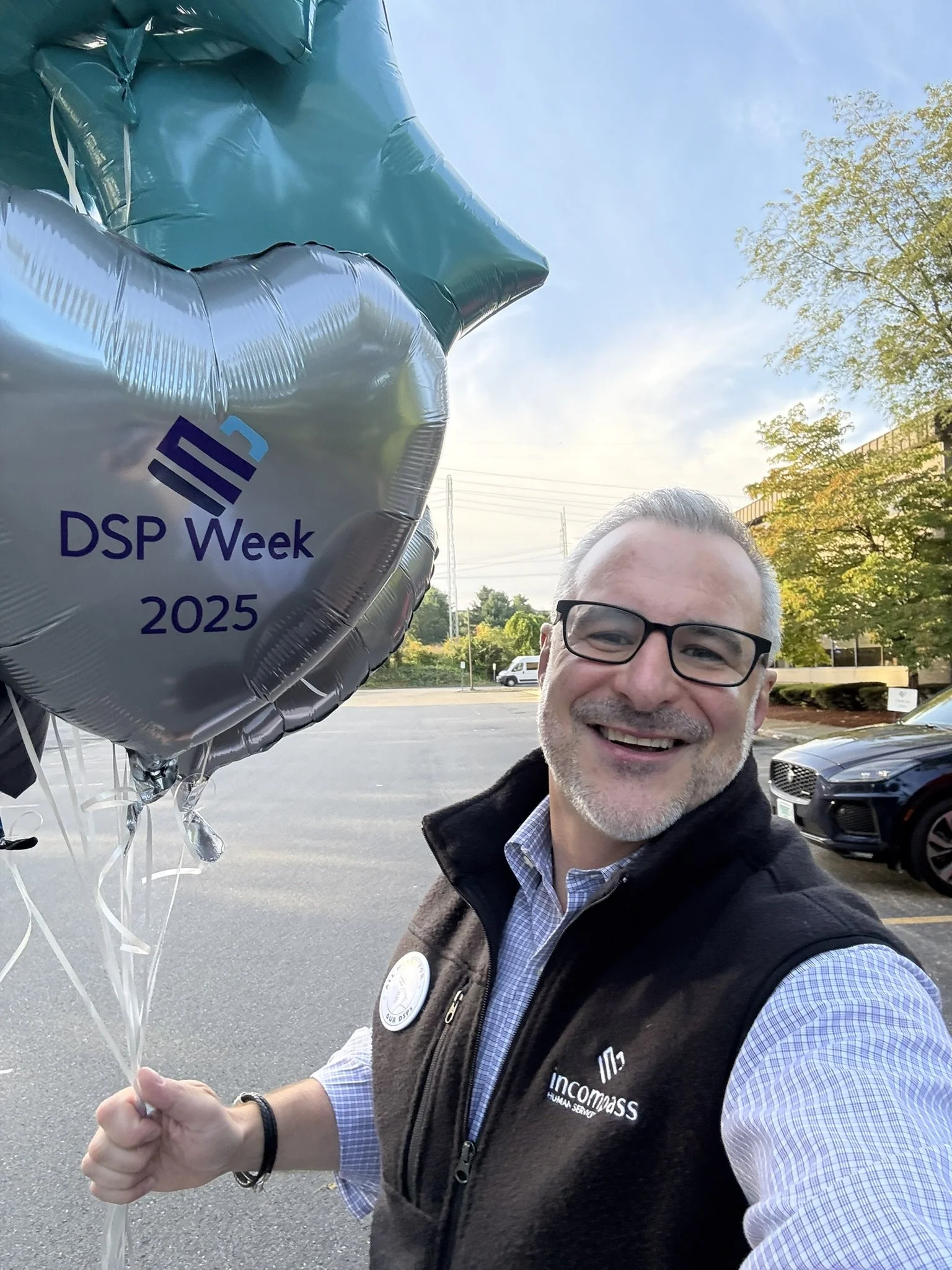 Dan celebrating Direct Support Professional Week 2025 with a balloon