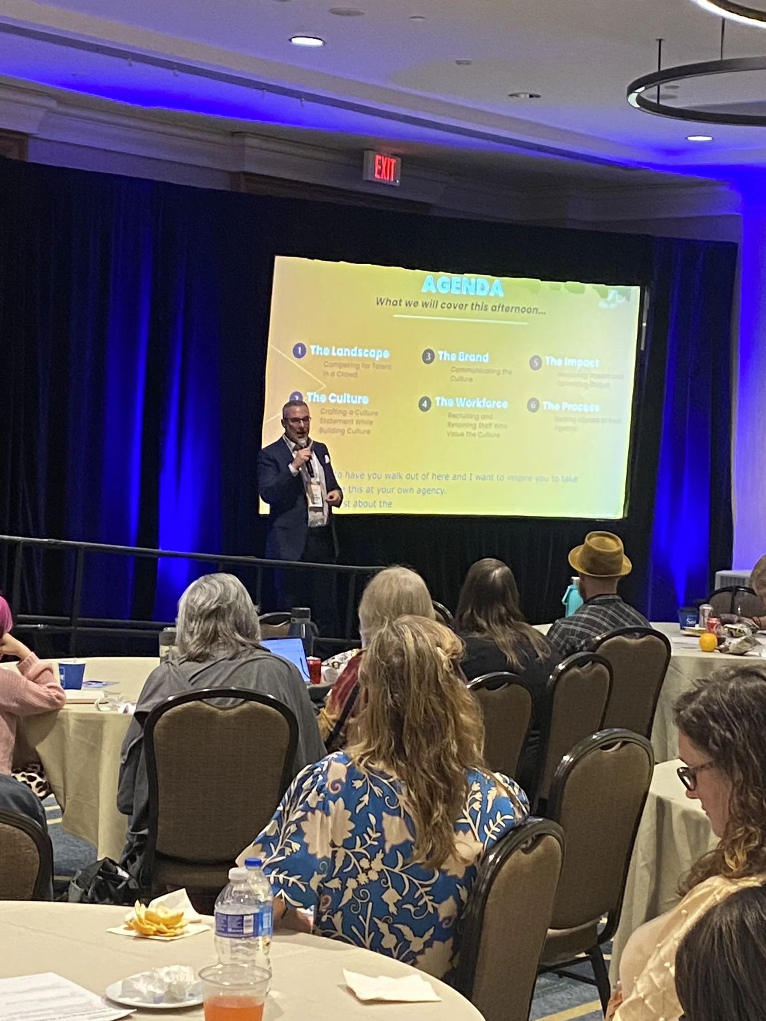 Dan leading a workshop in a large room