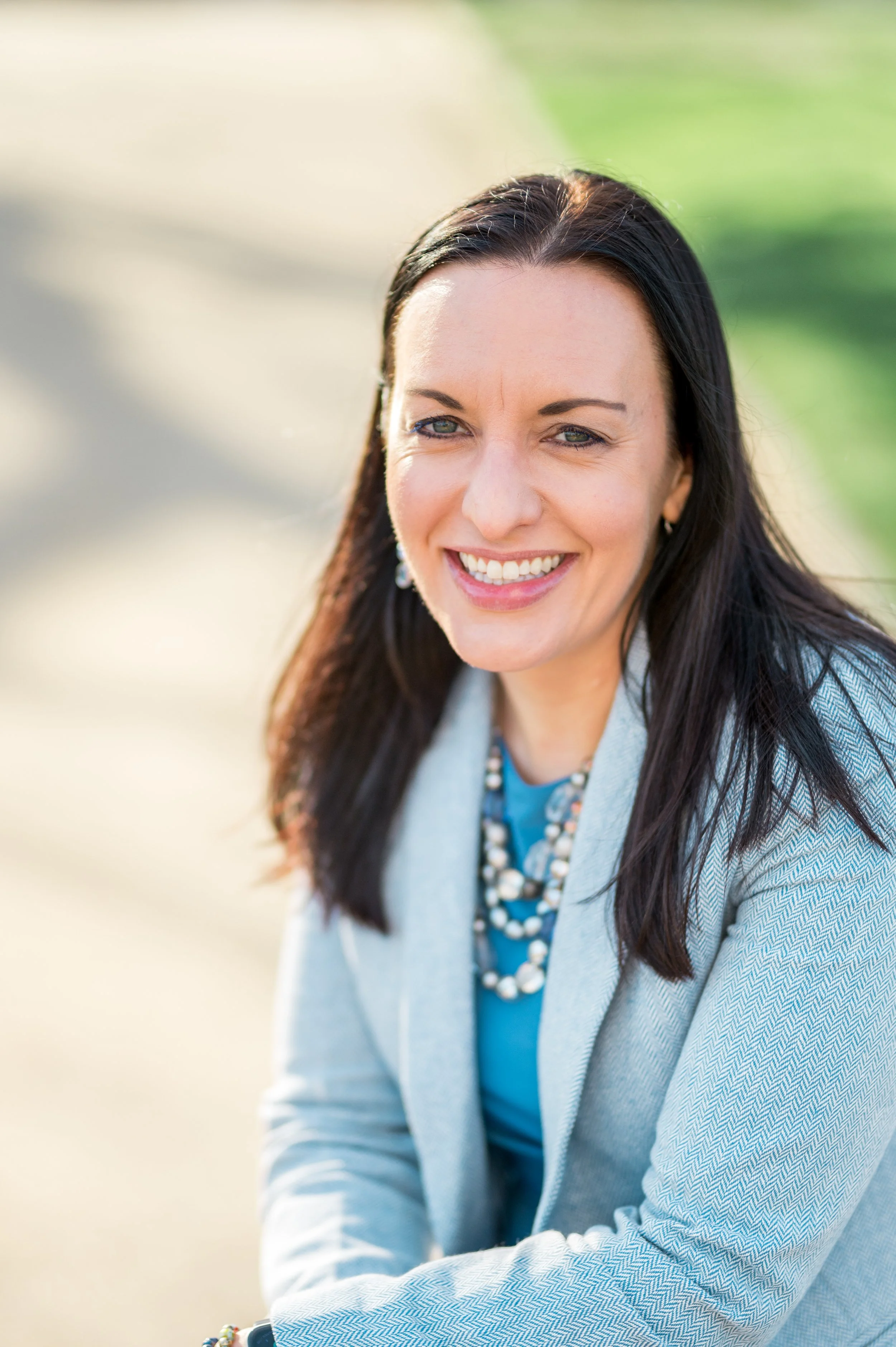 Michaele staring at camera on a sunny day