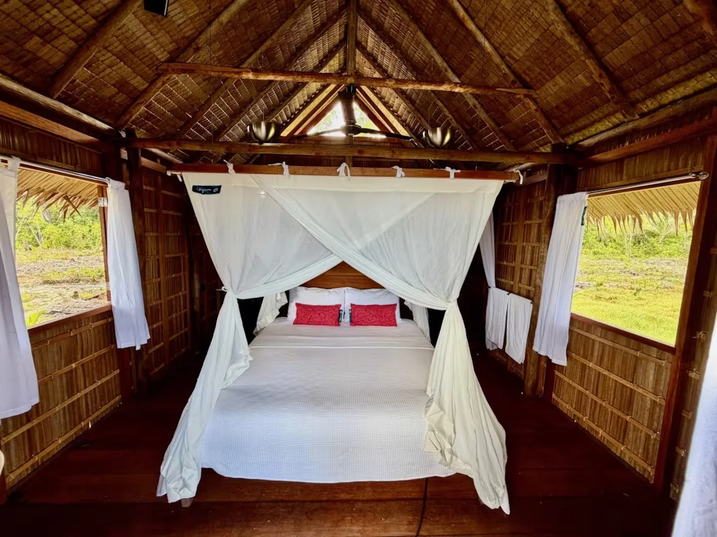 Beach guest house king canopy bed at ipyum.jpeg