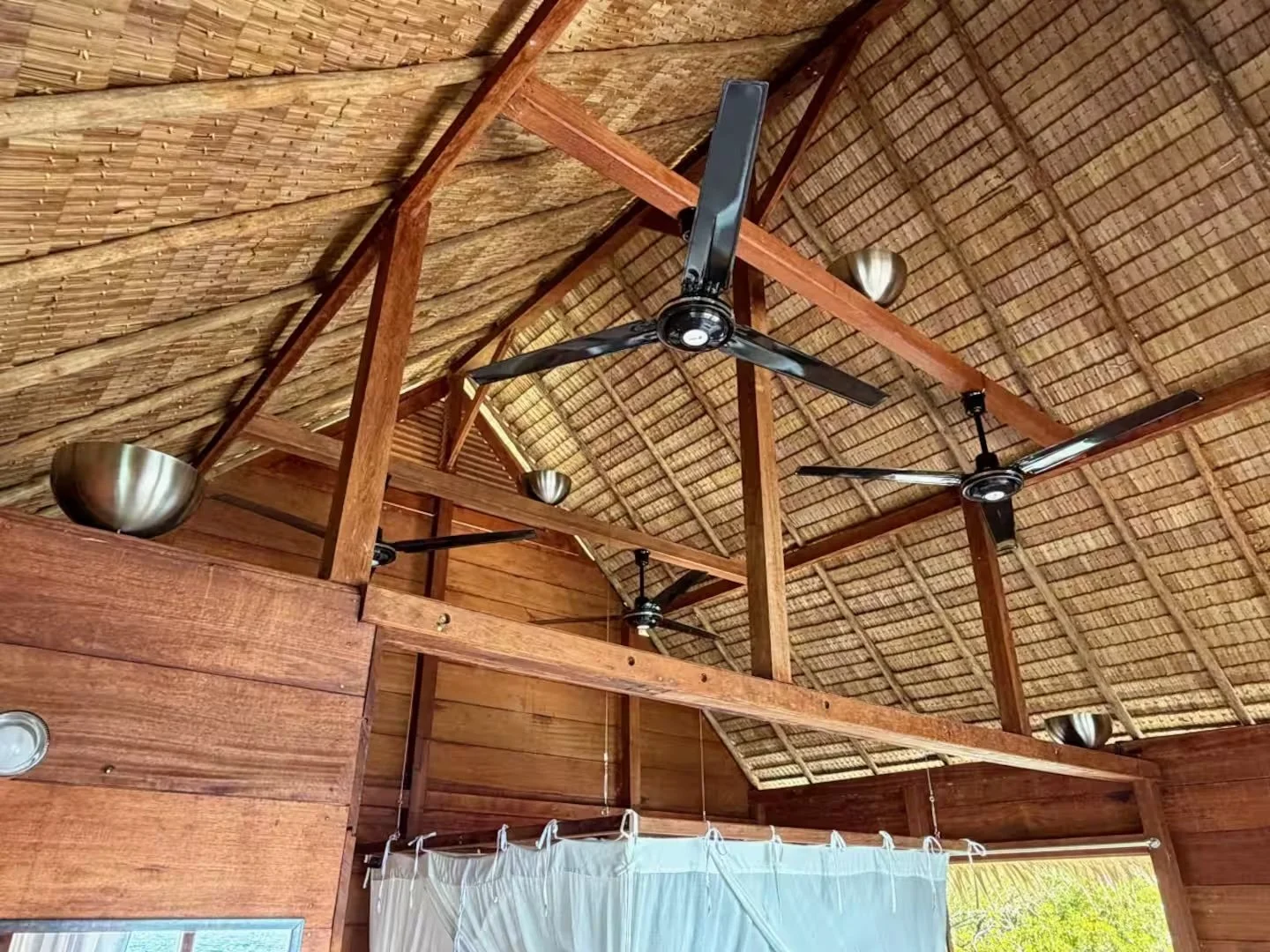 Overwater guest house natural roof and fans at ipyum.jpeg