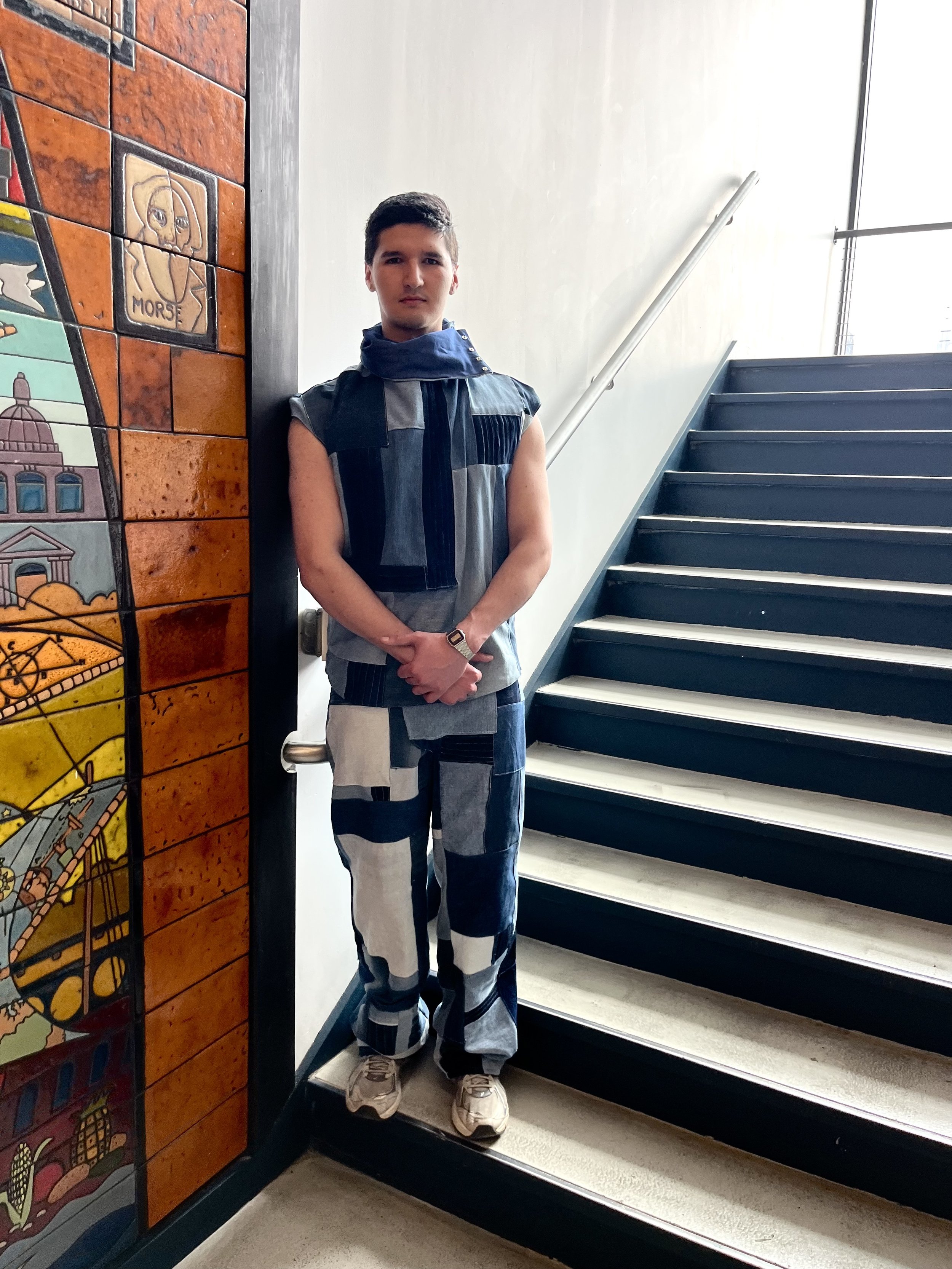 Men's Sustainable Patchwork Denim Two Piece Outfit designed for the drummer of the band Zile. The top features an adjustable stoveneck collar with snaps as well as snaps along both side seams for styling and performance purposes. This design was made
