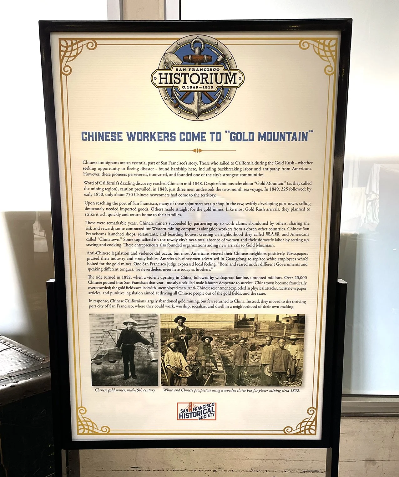 Historical informational board titled 'Chinese Workers Come to Gold Mountain', with text about Chinese immigrants' role in San Francisco's history, including images of Chinese miners and prospectors from the mid-19th century.