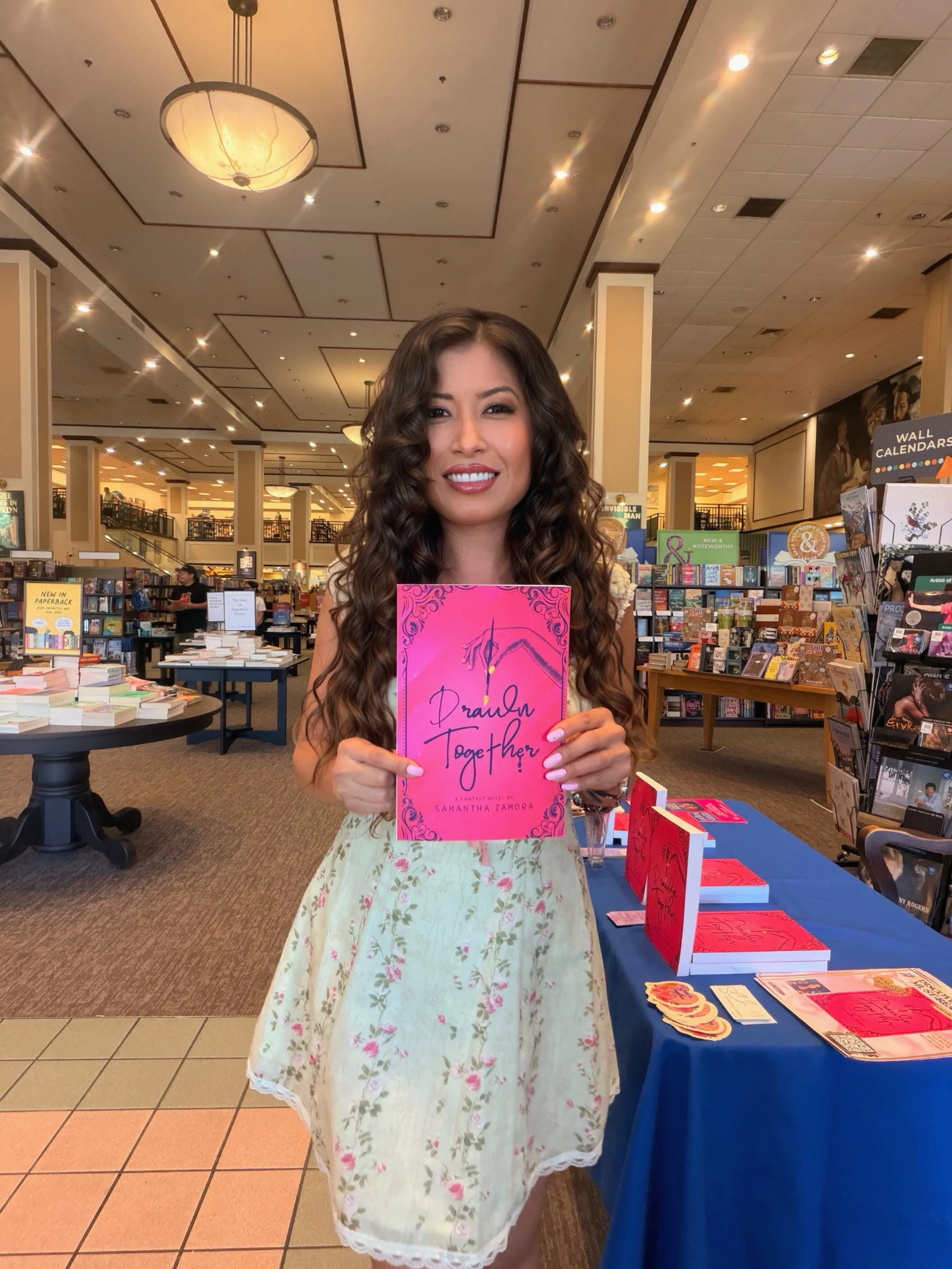 Samantha Zamora with a copy of Drawn Together during her Barnes & Noble Westlake Village author signing.