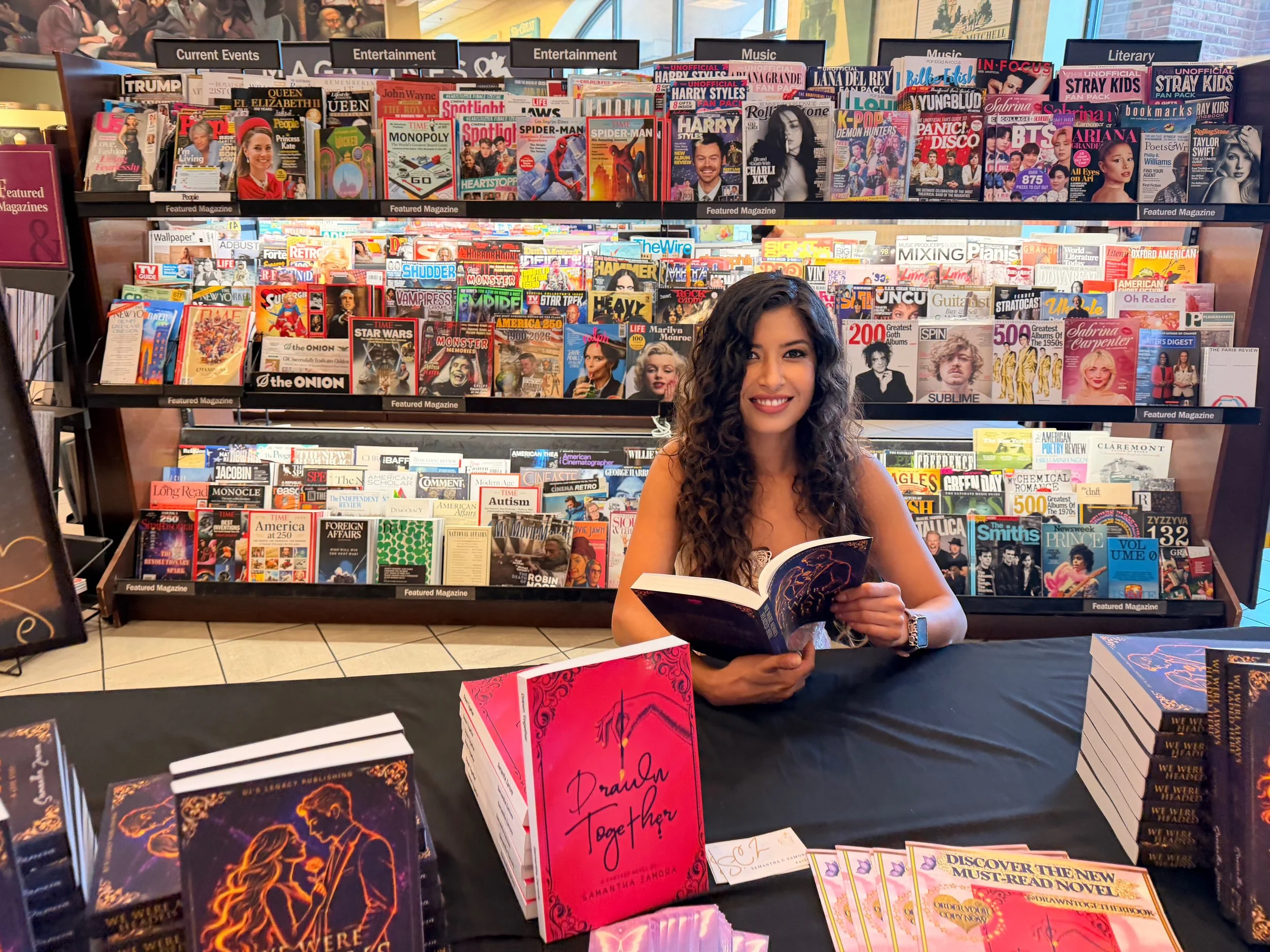 Author Samantha Zamora with copies of We Were Always Headed Here and Drawn Together at her Barnes & Noble Torrance signing.
