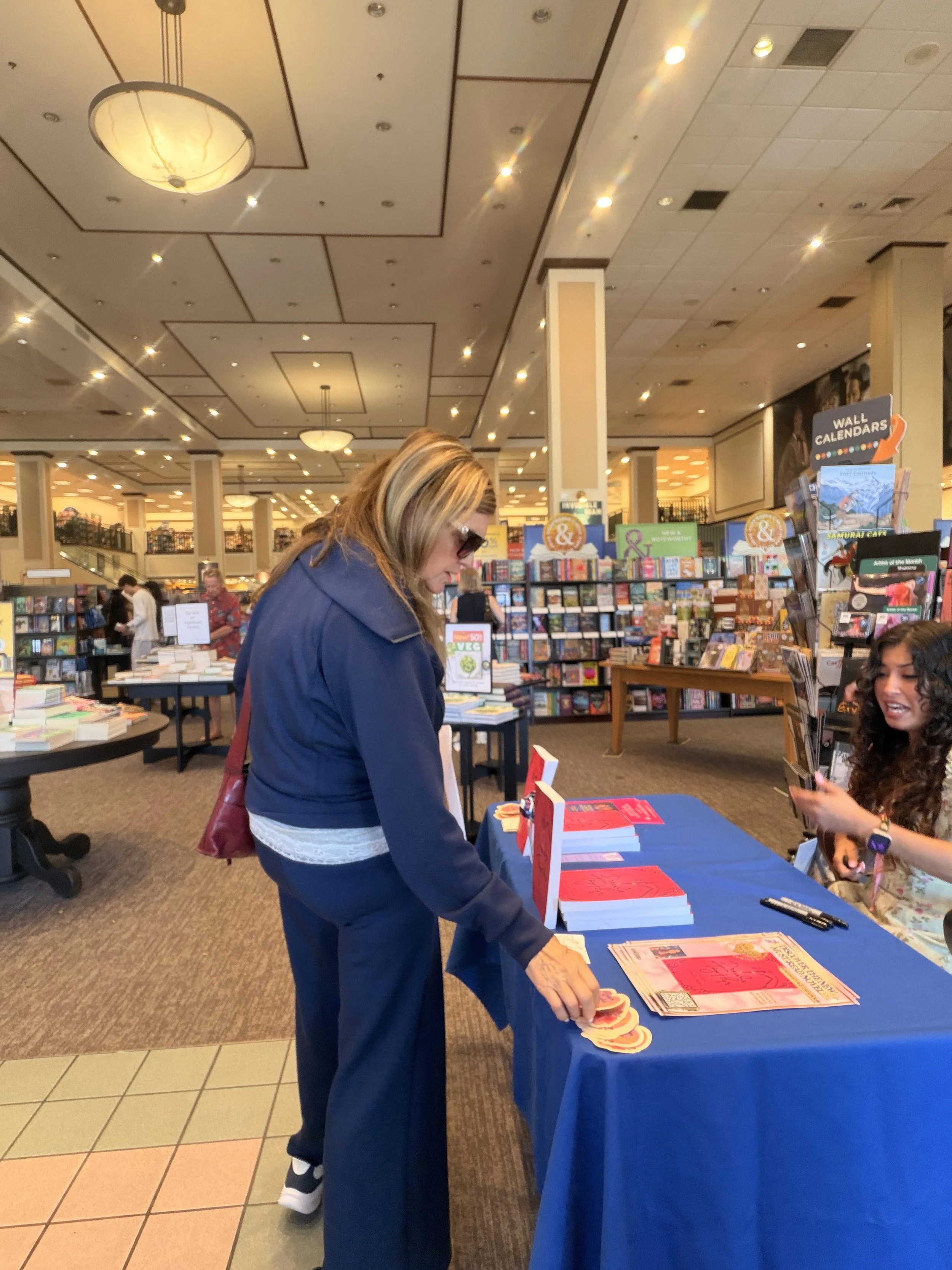 A reader browsing Samantha Zamora's books during her Barnes & Noble Westlake Village author signing.
