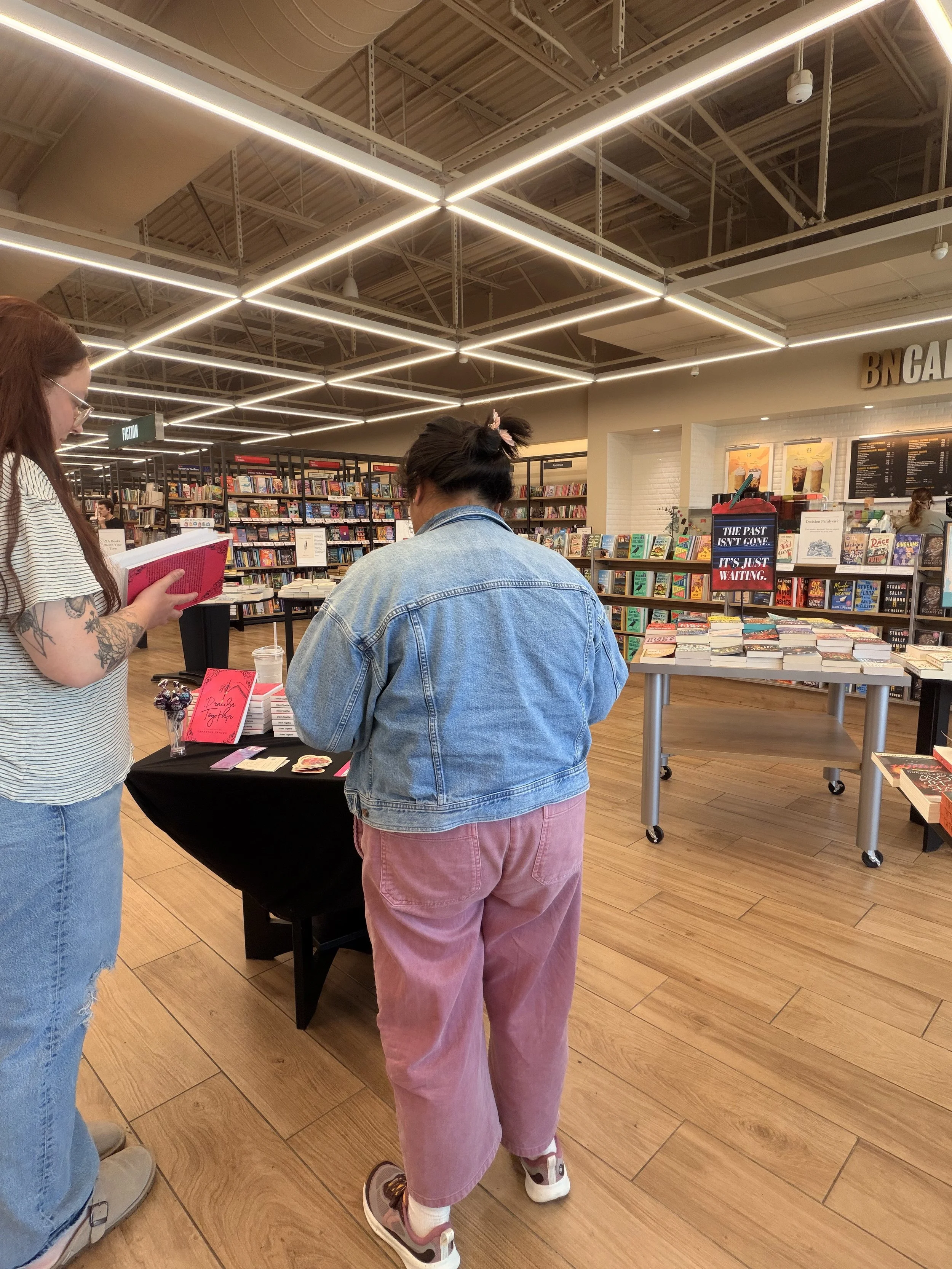 Readers exploring Samantha Zamora's books during her Barnes & Noble signing at The Veranda in Concord, California.