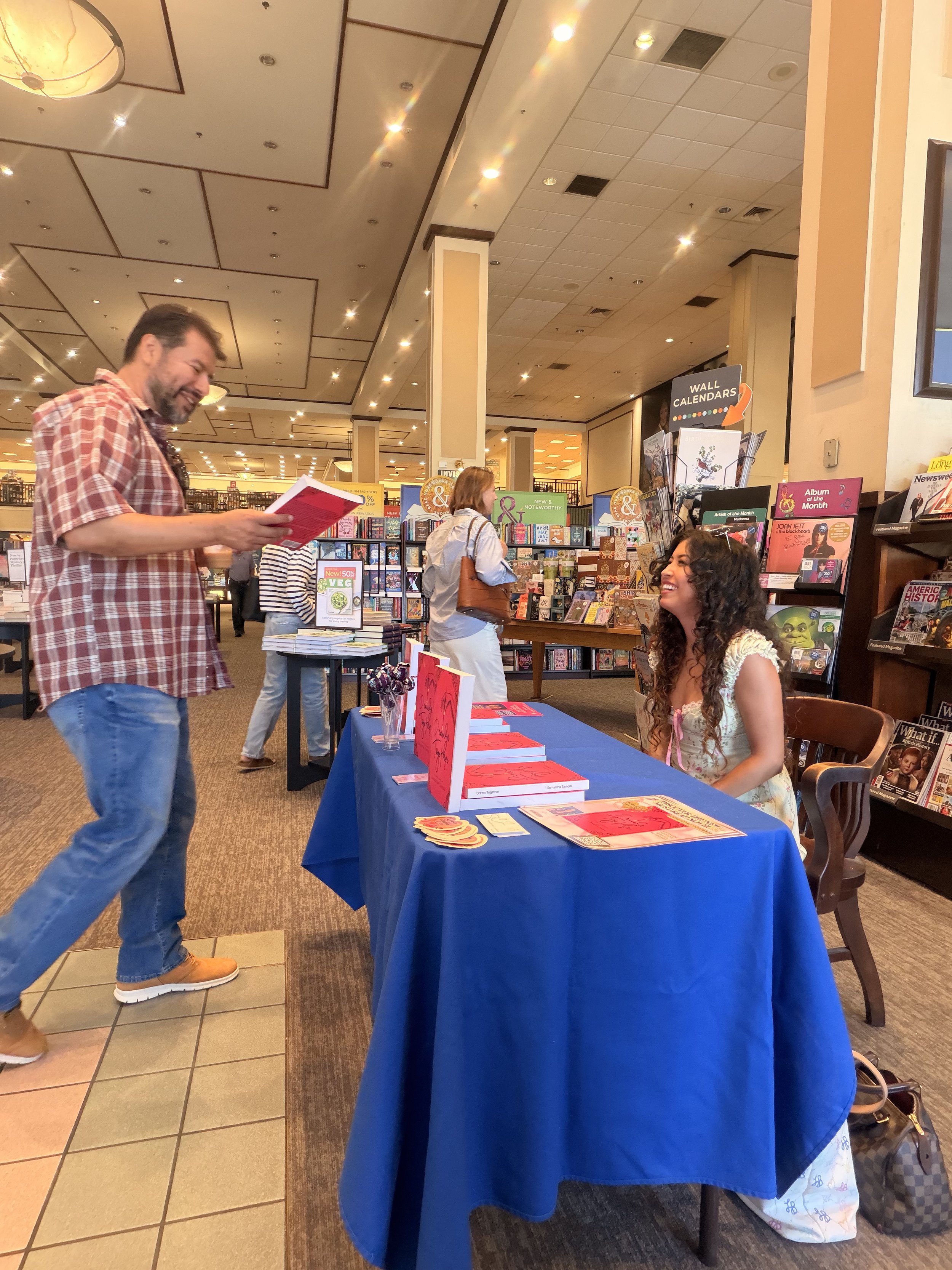 A reader discovering Samantha Zamora's novels during her Barnes & Noble book signing at The Promenade at Westlake.